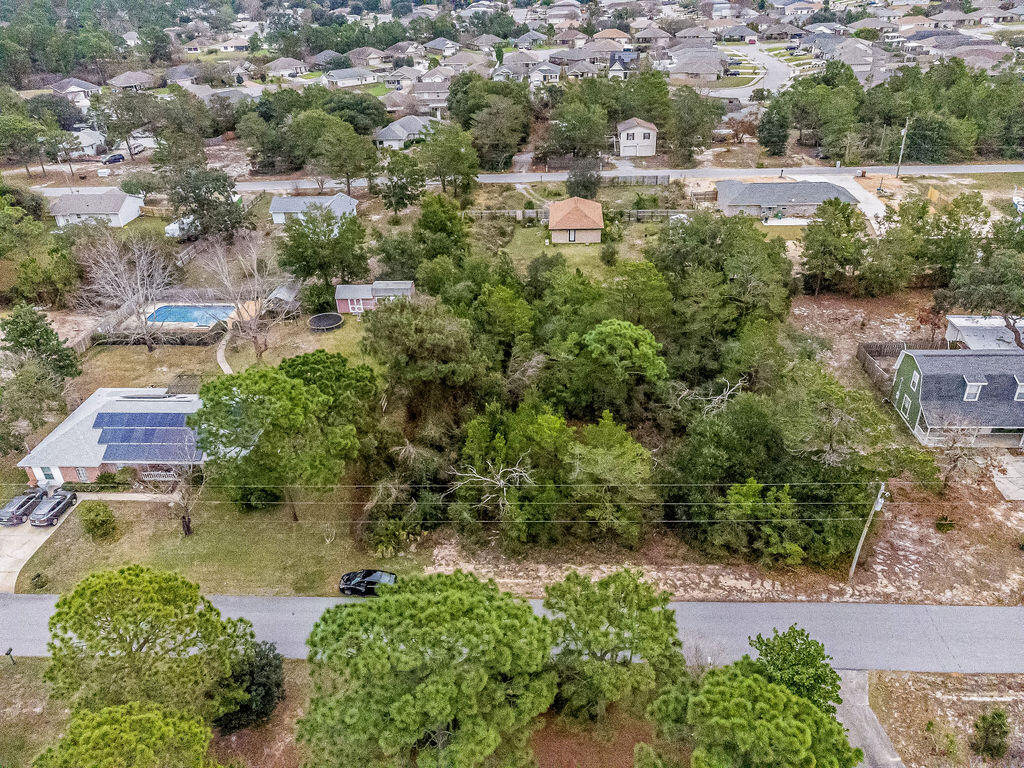Come build your dream home on the large .5 acre lot in Gulf Breeze. No HOA. No improvements have been made, tap fees have not been made. Located just 10 minutes from Publix and 16 minutes to Navarre Beach.