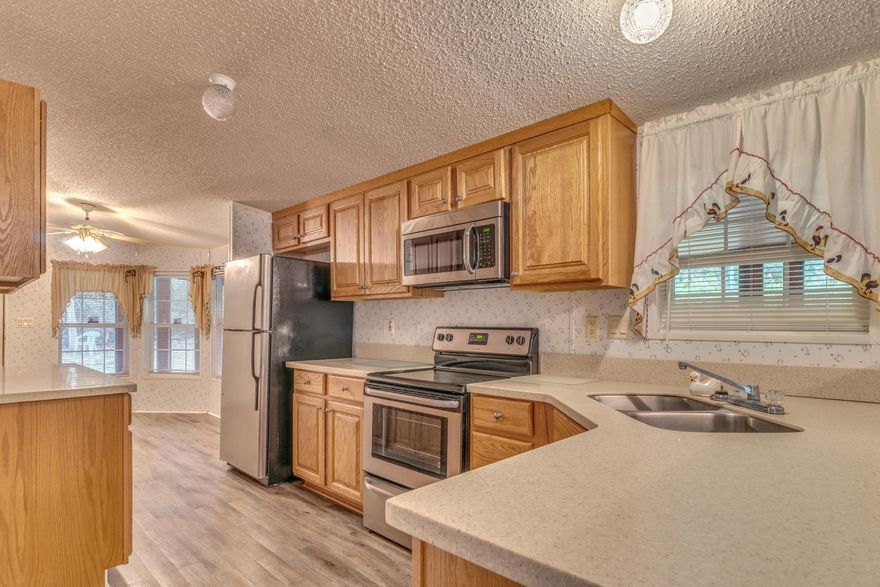 This 3 bedroom, 2 bath has it all! This house sits on 2 acres of fenced in land. It has a screened in porch that wraps around the entire front of the home. As you walk in you will notice the new granite counter tops in the kitchen. The kitchen boasts stainless steel appliances, tile, and breakfast bar. The living room has a ceiling fan, wood flooring, and a fireplace. The master bedroom is very spacious and includes brand new flooring. The additional bedrooms are very large and have wood flooring throughout. House has washer and dryer hook ups and a brand new a/c system. Outside pets will be considered but no inside pets allowed.