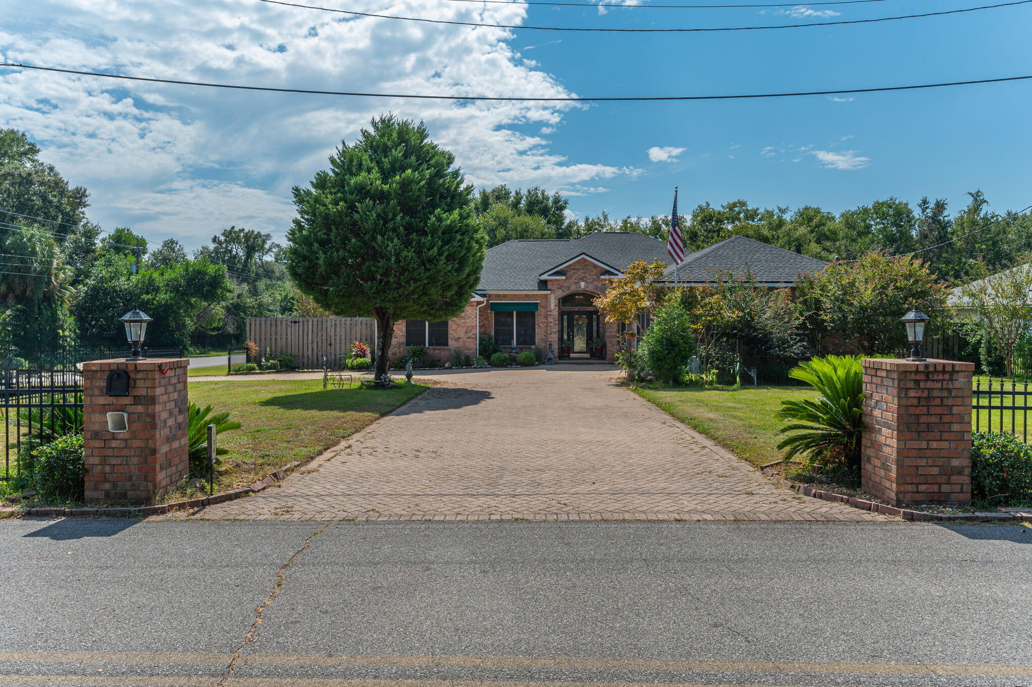 Pride of ownership is evident in this beautifully maintained pool home, situated on a picturesque corner lot. Since 2022, the home has undergone significant renovations, including a new roof, HVAC system and fresh interior paint. The guest bathroom has been fully remodeled with a custom tile shower, and new toilets have been installed throughout. Additional upgrades include a garbage disposal, new garage door motor, pool pump, refinished fireplace, updated kitchen appliances, and new ceiling fans and light fixtures. The home boasts high ceilings, crown molding, recessed lighting, and a thoughtfully designed floor plan that offers both functionality and comfort. With three spacious bedrooms and an office, there is plenty of room to accommodate your needs. The kitchen is a chef's dream, offering modern conveniences and style. For year-round enjoyment, the home includes a heated and cooled lanai, ideal for relaxation in any season. Outside, you'll find a sparkling enclosed saltwater pool! 