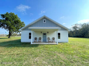 Loving the ranch lifestyle? This 10 acres is located on a dead end in the Nearing Hills area and is the quiet property you are looking for. Newer house with open floor plan, modern farmhouse style, laminate plank floor and tile throughout. Lots of windows bring the freshness of nature right inside. Kitchen features custom cabinets, quartz countertops, breakfast island. The owners suite has a large walk-in closet bathroom with twin vanities, custom tile shower, relaxing deep soaking tub. Bonus room can be third bedroom or office! Enjoy breezes on the screened-in porch or a hammock nap in the fenced side yard. There are two 2.5 acre pastures fenced and ready for immediate use as well as a riding arena. The pole barn is almost finished and provides garage parking, workshop and storage.