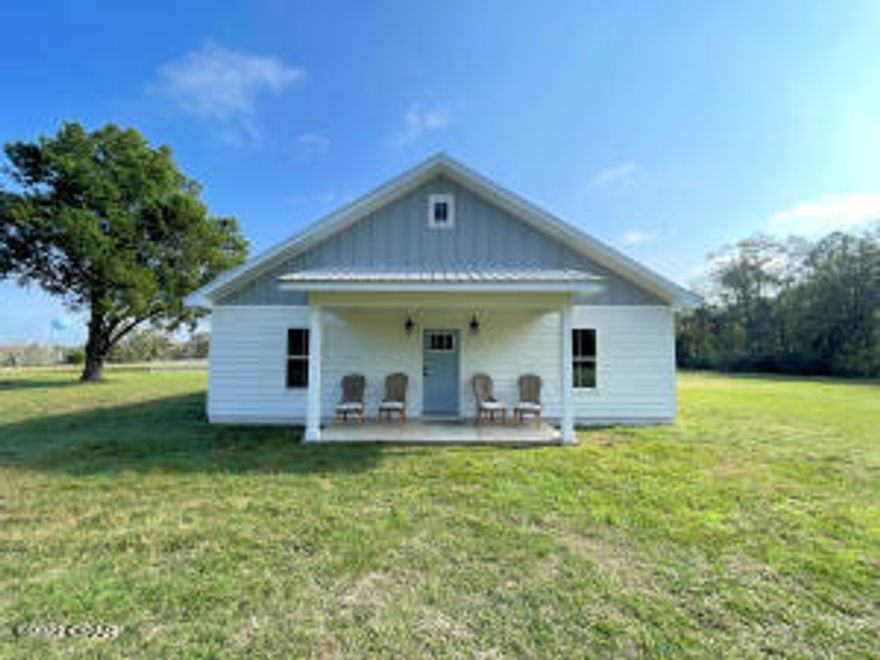 Loving the ranch lifestyle? This 10 acres is located on a dead end in the Nearing Hills area and is the quiet property you are looking for. Newer house with open floor plan, modern farmhouse style, laminate plank floor and tile throughout. Lots of windows bring the freshness of nature right inside. Kitchen features custom cabinets, quartz countertops, breakfast island. The owners suite has a large walk-in closet bathroom with twin vanities, custom tile shower, relaxing deep soaking tub. Bonus room can be third bedroom or office! Enjoy breezes on the screened-in porch or a hammock nap in the fenced side yard. There are two 2.5 acre pastures fenced and ready for immediate use as well as a riding arena. The pole barn is almost finished and provides garage parking, workshop and storage.