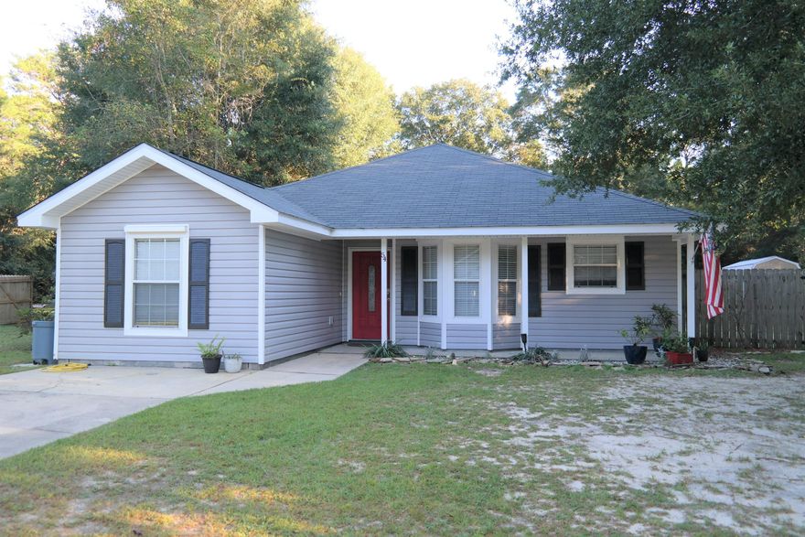 Great location for this 4 BR, 2 bath home on over 1/3 ac in growing Mossy Head.  Located within 2 miles of Blackstone Golf Course and just over 2 miles to Hwy 285 & I-10 for quick commute to Crestview, Niceville, Ft. Walton Beach and Eglin AFB. Also within 15 minutes to downtown Defuniak Springs. Located in a private cul-de-sac, the back yard is privacy fenced with raised garden area, chicken coop, rabbit pen, large storage building with additional loft storage, garden shed. Interior features include Cambria quartz countertops, vaulted ceiling, tile floors throughout (carpet in bedrooms), stainless steel appliances.  This is a must see so schedule your showing today!