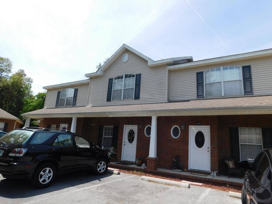 This great Townhome community was built by D & R Development. This unique upscale community only has 9 units in 3 separate buildings. As you enter the townhouses are flanked by an Old Majestic Oak Tree. You have a covered front porch, brick on the first floor and vinyl on the second floor exterior. 30 year Owens Corning three dimensional roof. Energy efficient all electric home with a 50 gallon HWH. Home comes with a refrigerator, microwave, dishwasher, stove and washer/dryer. Tile floors on the first floor and carpet upstairs. Interior walls have rounded corners, orange peel ceilings, dual hung fold-in windows, storage under stairs, laundry room and cultured marble counter-tops and sinks in bathroom. Utility room with washer/dryer located on first floor.