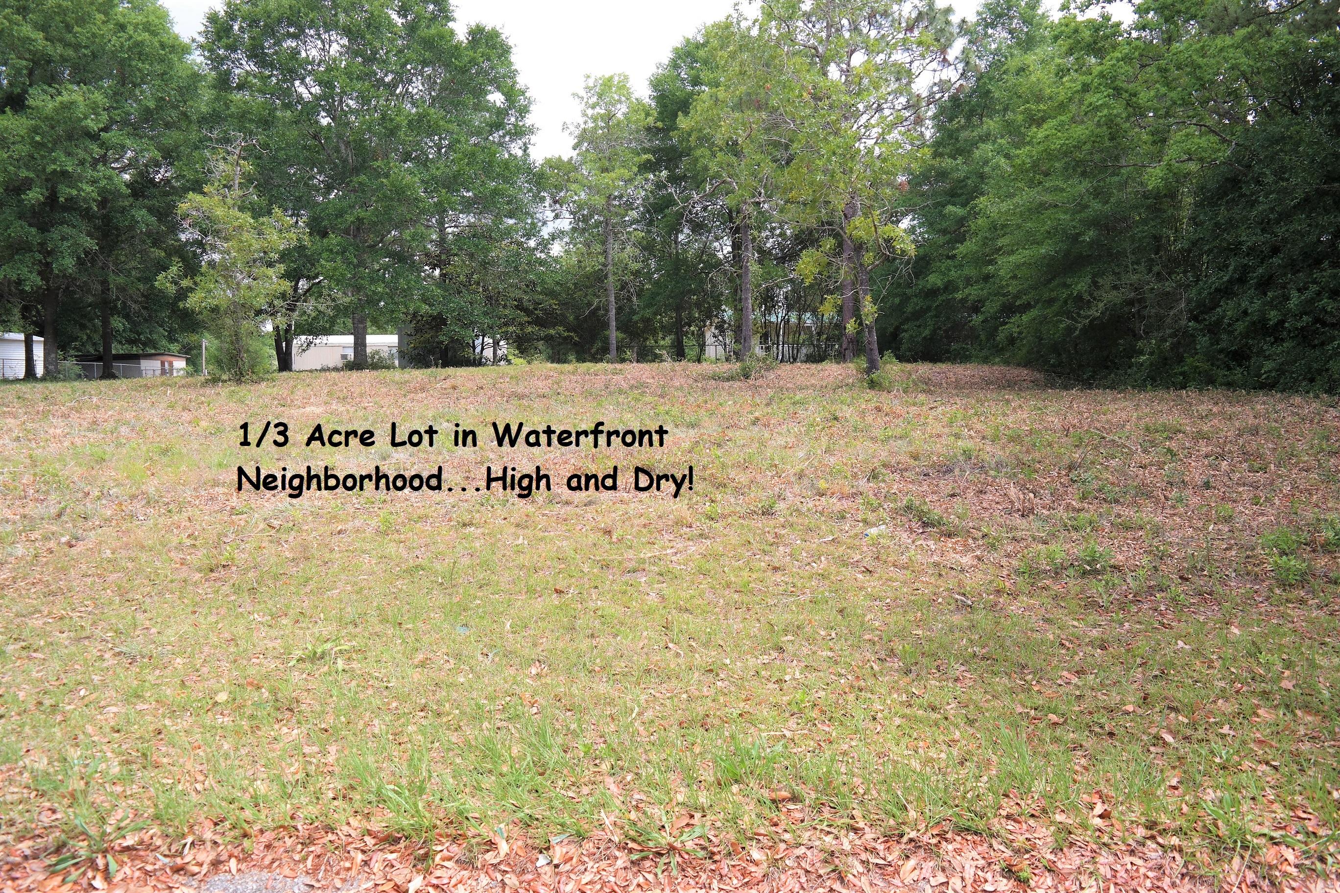 This is a great homesite in lakefront neighborhood on Juniper Lake. Juniper Lake Park and public boat launch is less than 1/2 mi. down the road. Lot is high and drive with water views across the street. Public water is available in this neighborhood (tap fee would need to be paid). Power available on street; Septic would be required. This would be a great homesite for a new-build or have a manufactured home set on lot!
