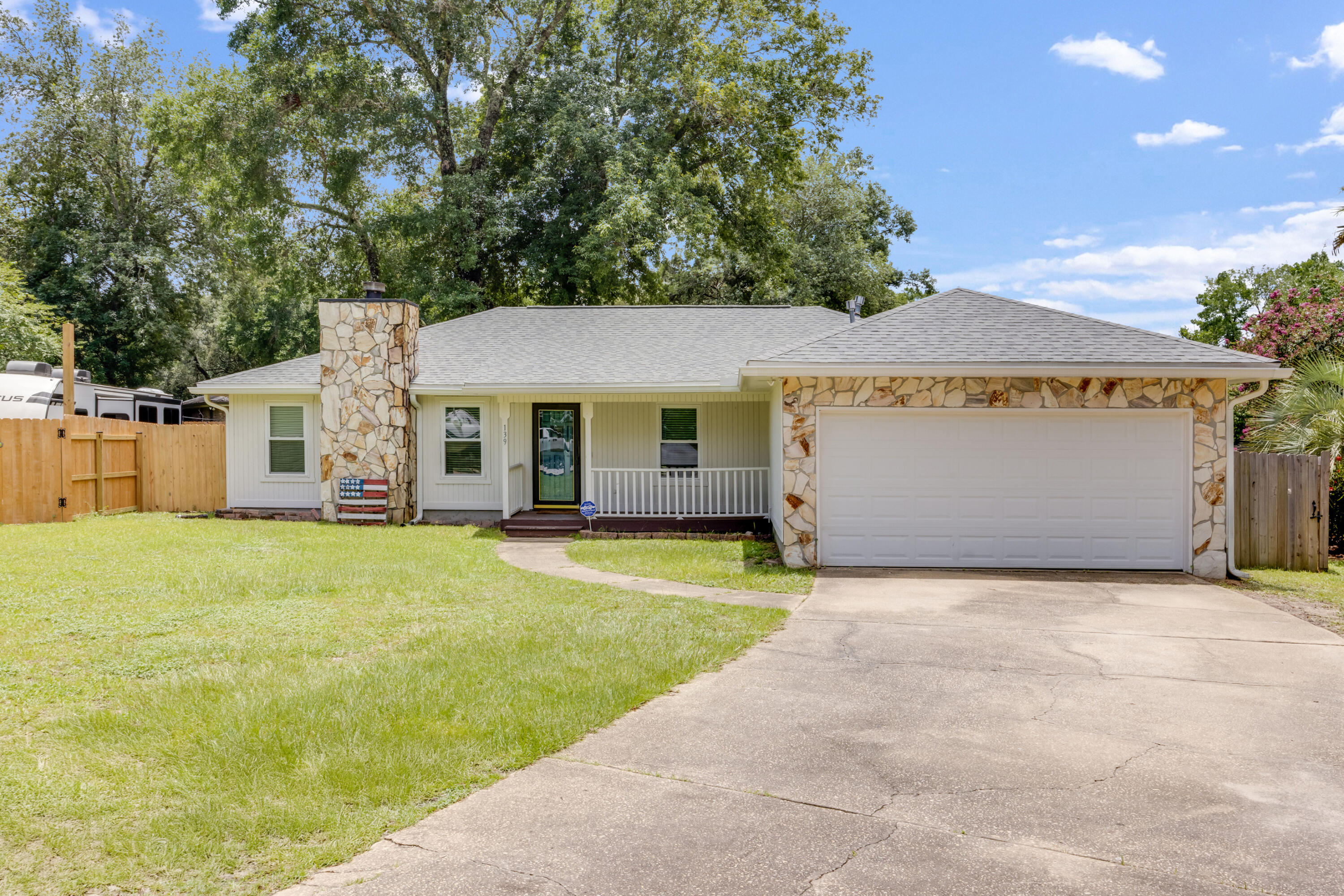 3BR/2BA + office on a quiet cul-de-sac with 2-car garage and large fenced backyard. New roof and water heater (2022), new windows, gutters, light fixtures, and freshly painted interior. Kitchen boasts dark shaker cabinets, granite counters, stainless steel appliances, and shiplap accents. All tile flooring--no carpet--with trayed ceiling in the living area. Both bathrooms recently updated with modern finishes. Master suite features walk-in closet and private patio access. Laundry room updated with shiplap. Backyard includes a large deck and 50 amp RV plug--perfect for guests. Minutes to Destin beaches, shopping, Eglin AFB, and Duke Field. No HOA!