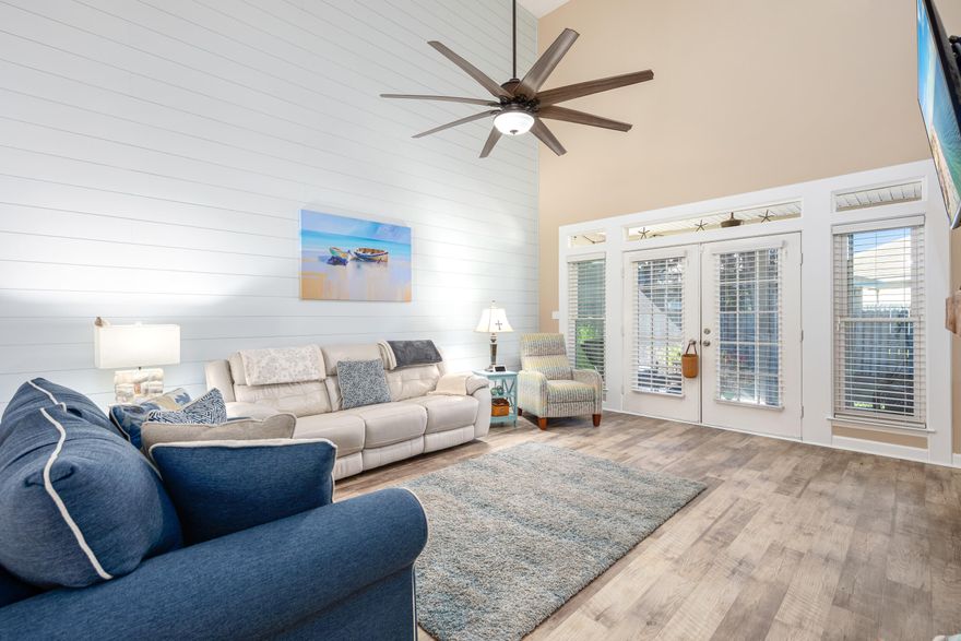 Welcome home to a charming, meticulously cared for coastal oasis! This townhome is situated .1 miles to the bay and .8 miles to the gulf along with the best restaurants and shopping! You'll enjoy an open concept living area with a fireplace, shiplap walls, new lighting and premium vinyl plank floors. The master on main provides convenient access to the screened in porch to sip your coffee overlooking a lawn cared for by the HOA.The kitchen is the heart of the home with unique custom cabinetry, large island with tons of storage, quartz counter tops, under cabinet lighting and designer backsplash. Windows are hurricane impact. Brand new carpet in upstairs bedrooms. Guest bath boasts a luxurious omni-directional multi head shower experience. Pool is only a few steps away!