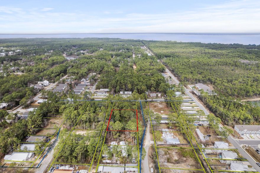 INVESTOR ALERT*This Wooded Parcel In Highly Sought-After Santa Rosa Beach Presents A Prime Investment Opportunity. The Property Consists Of Four Separate Lots, Totaling 0.57 Acres, Offering The Flexibility To Develop Individually Or As One Large Homesite. A Mobile Home Is Currently On The Property & Will Convey As-Is With No Contributory Value. Located Within A Mile Of Cessna Landing Park, Which Features A Public Boat Ramp & Just A Few Miles From Ed Walline Beach Access At Gulf Place,This Property Is Perfectly Positioned For Enjoying Both The Bay & The Gulf. The Chat Holly Area Is Poised For Tremendous Growth, With A 10,000-Seat Amphitheater & Entertainment District Approved For Development Just A Mile Away. This Transformative Project, Set To Break Ground In 2025, Will Span 220 (More...) Acres & Feature Six Lakes, Walking Trails & Recreational Amenities, Making This An Exciting Time To Invest In This Up-And-Coming Location.

Don't Miss This Versatile Opportunity! Whether You're Looking To Build, Develop, Or Hold For Future Appreciation, This Parcel Offers Unmatched Potential In A Rapidly Growing Market. 