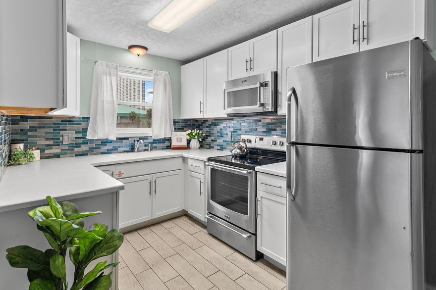 Welcome to your slice of paradise at St. Martin 313--a beautifully updated, turn-key 2-bedroom beach condo located on the ground floor south of Highway 98 in the heart of Destin. Just steps from your private, gated beach access, this unit offers the perfect blend of comfort, convenience, and location. Whether you're looking for a second home or a serene beach getaway, this condo delivers effortless coastal living. Inside, you'll find a stylish coastal kitchen with quartz countertops, a custom backsplash, storybook cabinetry, and stainless steel appliances. Tile flooring flows throughout the space, and the bathroom has been tastefully updated. The unit has a balcony to enjoy the salty air and morning coffee. The St. Martin complex has recently undergone renovations and now features fantastic community amenities including a sparkling pool, tanning deck, picnic area, and outdoor grilling stationsperfect for entertaining or relaxing after a day at the beach.