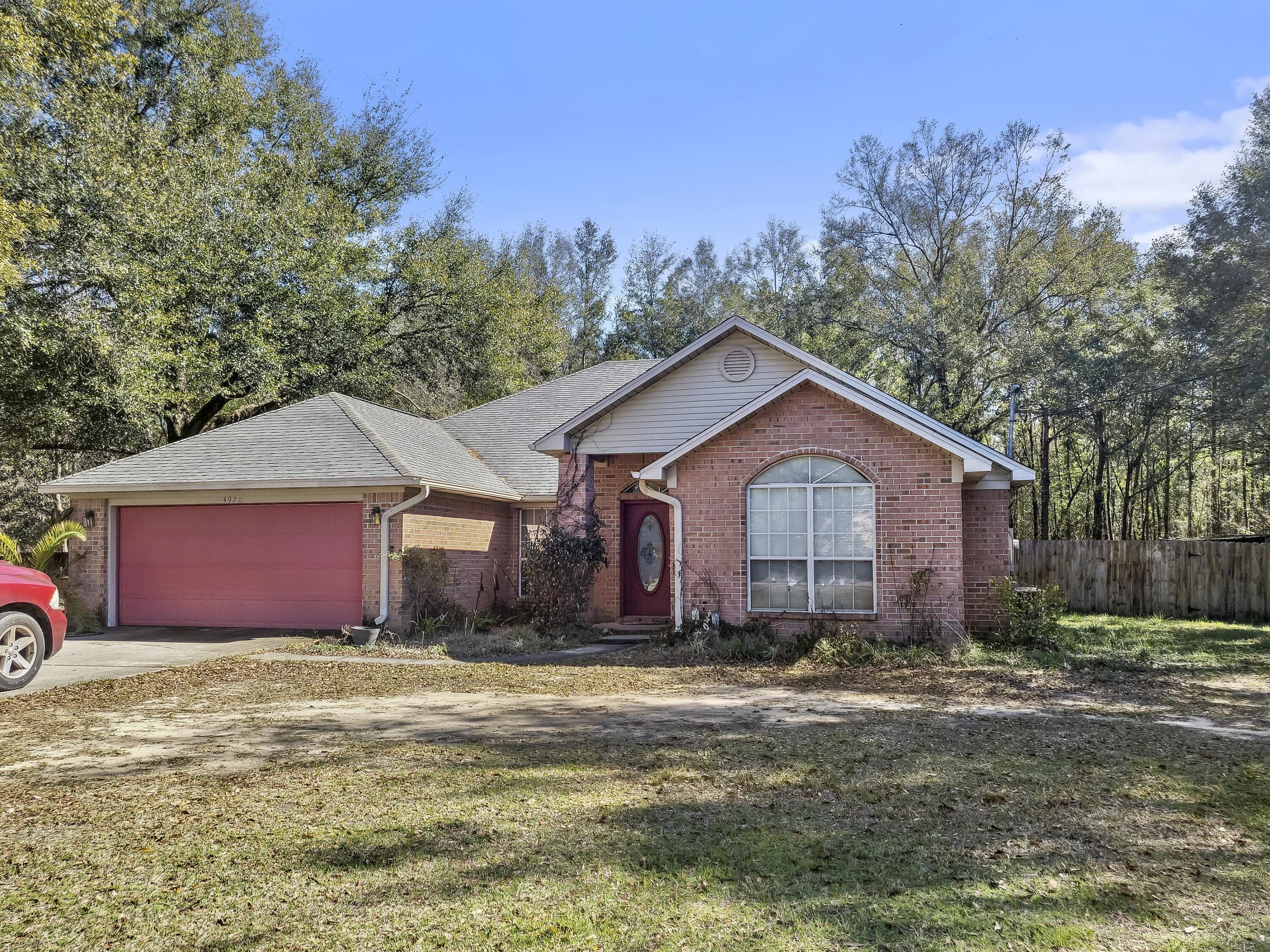 Price Reduced!!! 4-bedroom, 2-bathroom brick home situated on a picturesque level lot spanning 0.69 acres. This home boasts spacious living areas, ample natural light, hardwood and tile throughout, The split bedroom floor plan offers comfort and privacy, while the master bathroom boasts a garden tub, walk in shower, dual vanities and two walk in closets. Enjoy relaxing and entertaining outdoors on the expansive lot, which offers plenty of room for outdoor activities and gardening. With its prime location, this property offers easy access to local amenities, shopping, and dining. Don't miss out on the opportunity to call this charming brick home your own!
