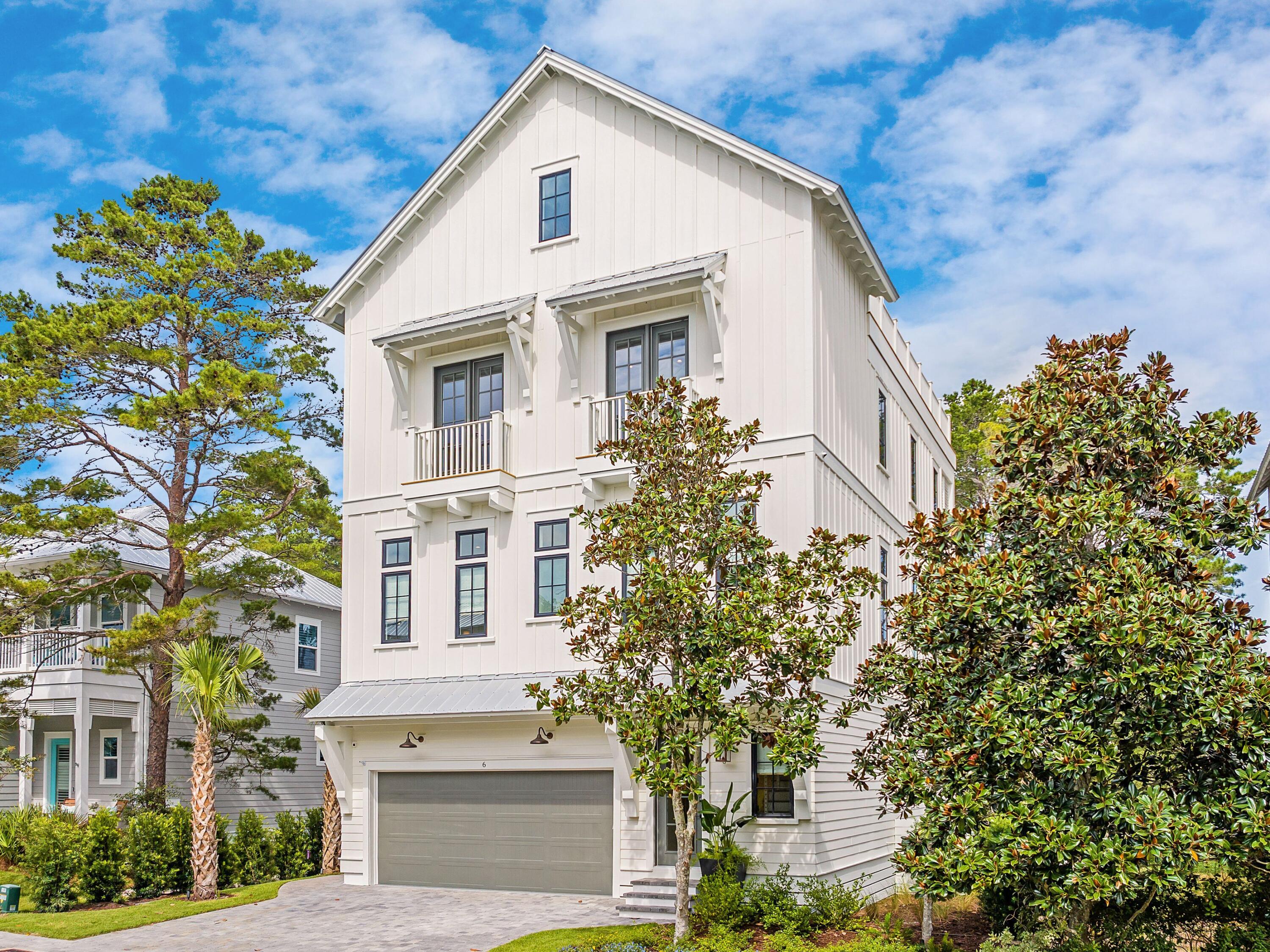 Recent Appraisal on file for $2,315,000. Artistically marrying coastal design with contemporary luxuries in a developed waterside community, this four story, 3,578 square foot home by 30A Builders encapsulates elevated construction with total livability. Located near the community pool, clubhouse and kayak launch, this property gifts future owners and guests views of Lake Powell and plentiful spaces for work, play and relaxation. The first level of the home welcomes with shellstone floors, custom artwork nooks with lighting, and a three stop elevator. A private flex room, ideal for a bunk space, home office or ground level sitting area provides convenience as well as direct access to the backyard oasis. Featuring lush landscaping, a large private pool and artificial turf, the fully fenced backyard is perfect for soaking up the sun or enjoying sunset with friends and family. A guest room and shared full bath provide additional accommodations on the first floor.
Featuring a reverse floor plan, this new construction home offers a modern chef's kitchen, glass front butler's pantry, wet bar, dining and living room, all flooded with natural light thanks to floor to ceiling large panel windows. The black ZLine gas range and white oak cabinet doors add a touch of organic refinement to the spacious layout, while additional seating around the eat-in island and outdoor seating on the second level covered porch provide endless opportunities for transitional living. The second level of this home also offers a curated full bath and guest bedroom with oversized windows, ample sized closets and designer fixtures.
The third level features a primary suite with freestanding tub, oversized walk-in shower and custom plaster vanity, and walk-in closet. The third floor balcony is also off the primary suite, providing a transitioning living space filled with privacy and lake views. A full bath, guest room, laundry and bunk room are also provided on the third level alongside a cozy living space with beverage bar.
The fourth level provides an additional flex space plus access to the top level living deck with summer kitchen, covered dining space and endless open area for entertaining and relaxing, all with direct views of Lake Powell. Home can be sold furnished, contact Listing agent for further details.