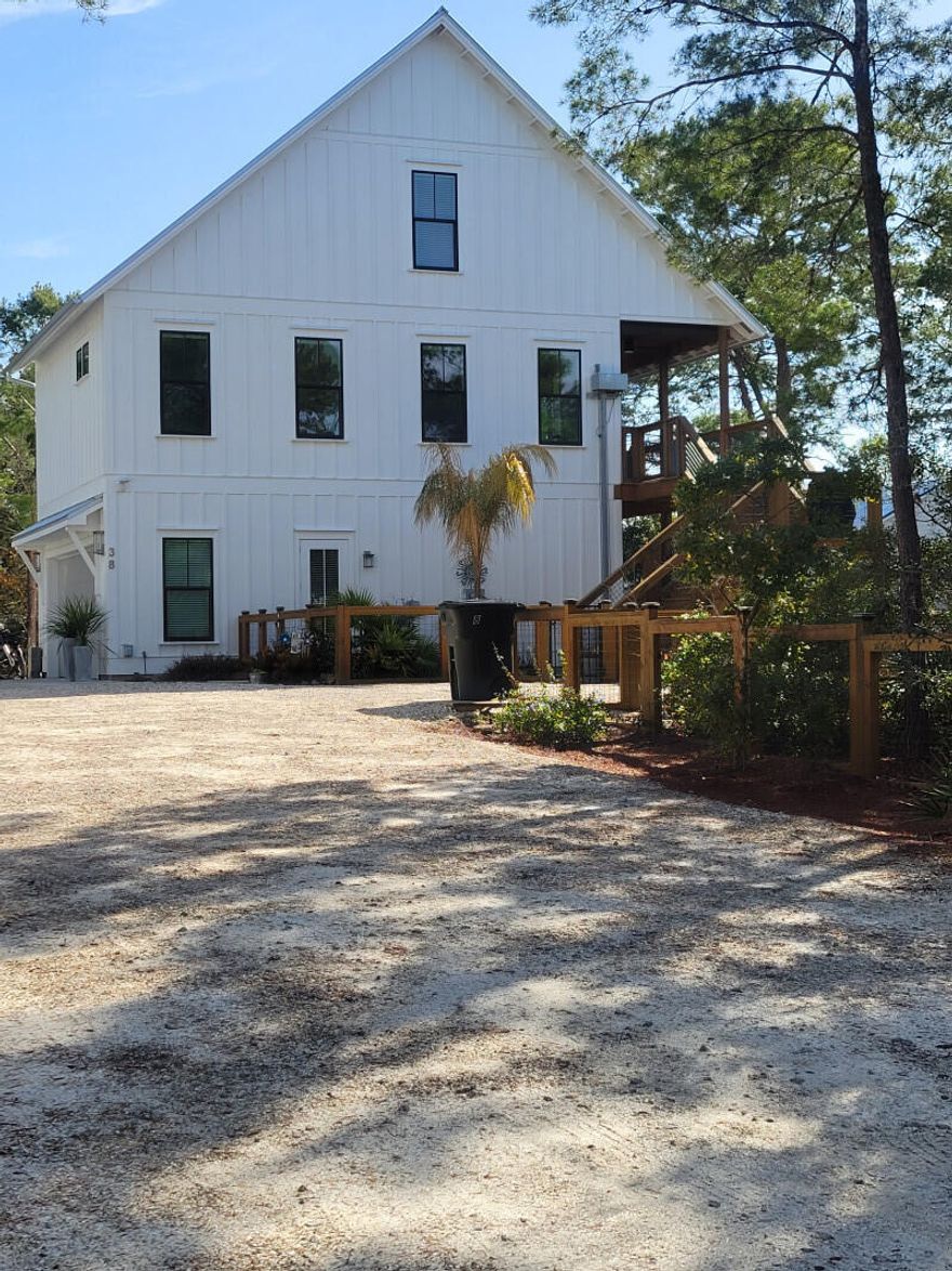 3 Story Luxury Carriage House              All measurements are Approximate 1st floor  large 2 car garage with walk in laundry room and storage ,  small guest room with .5 bath outside patio and covered deck with 6 person saltwater Jacuzzi and Large full walk-in shower. Lift  from 1st to second floor. 2nd floor living floor,  large master with walk-in closet ,  large bathroom with steam shower and toilet room / closet 3rd floor access using accordian stairs.   Fuly finished 12/24 room with floor to ceiling windows,  flooring central heat and cooled .  Perfect area for storage , office or kids room.Fully fenced ,  solar lights,  large drive for plenty of parking, lot is ready to build main house or install pool. NO HOALive while you build or rent while you build. .