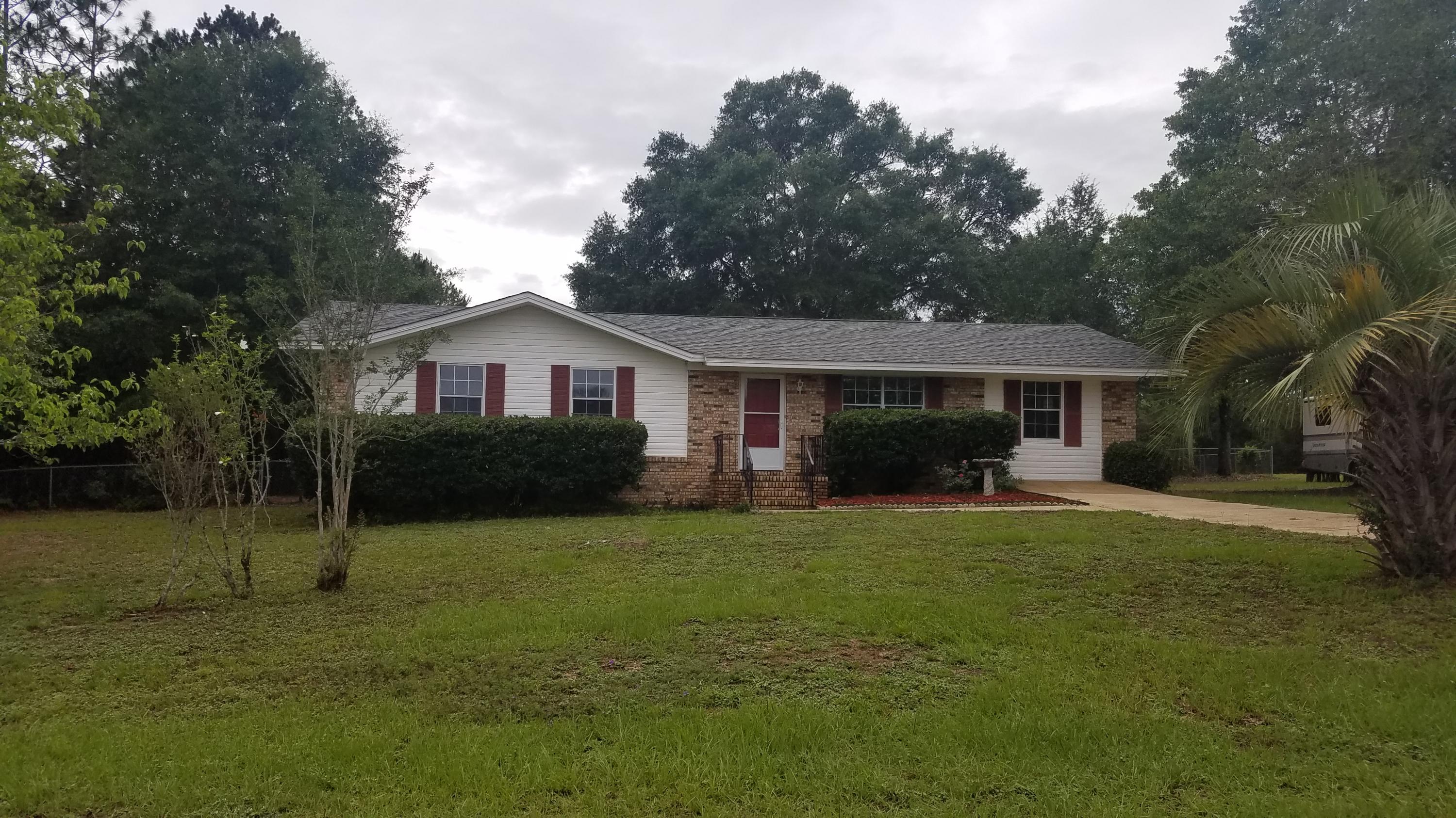 BACK ON THE MARKET BUYERS FINANCING FELL THROUGH. Lovely 3 Bdrm 2 Bath brick home nestled on 1 acre corner lot. This one features split floor plan, newer dimensional shingle roof, laminate flooring, crown molding, new paint, new carpet in bedrooms and tile in wet areas. Kitchen sports brand new stainless appliances and tile island with extra storage. AC was replaced in 2011 and hot water heater replaced in 2013. Nice deck on the back for grilling and two large metal sheds. Washer, and dryer in utility room are negotiable. This little gem will not last long. Call today to schedule a tour! Buyer to verify measurements and any information deemed important.