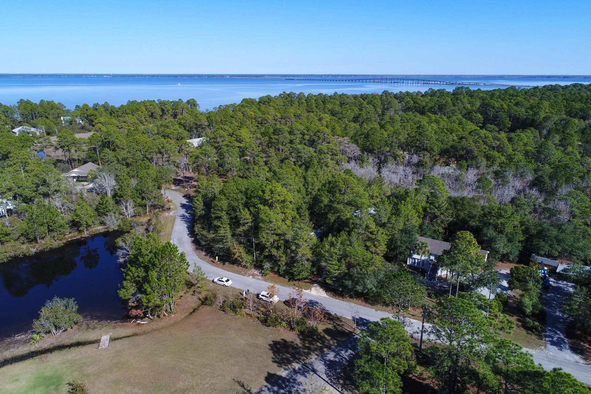 Beautiful 1/2 acre secluded CANAL front vacant lot for your new home or purchase it with the home next door for 1 total acre of privacy!! Located in an X flood zone, no homeowners association and has a canal in the back to canoe or paddleboard to the bay! Photos of the home are of the home owned by the same sellers that is also listed on the MLS for sale! Located near several great amenities such as Padgett Park, Alaqua Unleashed dog park, Walton County library, Walton County Courthouse Annex, South Walton High School, North West Florida State College Annex, and the Boys and Girls Club all located off of JD Miller Road! Footage of lot is approximate. Home next door MLS listing # 766318. Please note, sellers are firm on the sales price.