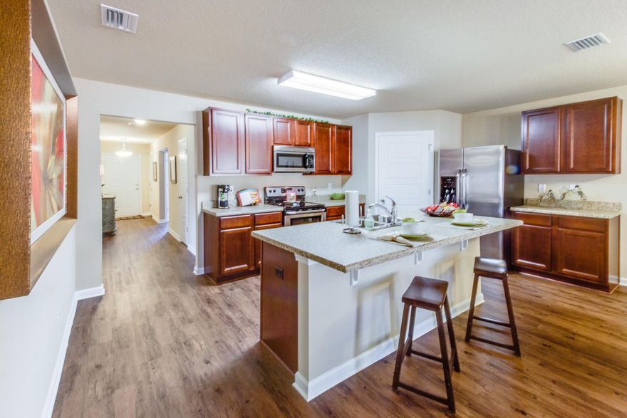 The Cali is a one story floor plan featuring 4 bedrooms, 2 baths, covered back porch & 2 car garage. The open kitchen features an island, stainless appliances and granite countertops. The kitchen opens to the great room w/ access to the covered porch. The master suite is just off the back side of the house & master bath features a walk in closet and dual sinks. Pictures, photographs, colors, features, and sizes are for illustration purposes only & will vary from the homes as built. Home & community information including pricing, included features, terms, availability and amenities are subject to change and prior sale at any time without notice or obligation.