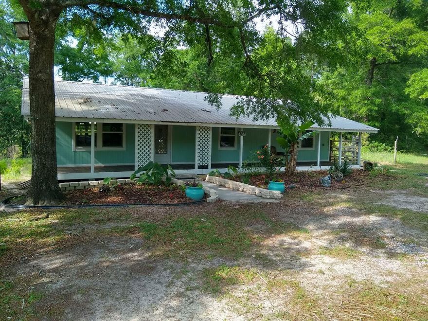 New floors, windows, paint, updated kitchen, and A/C installed this year! Screened in back porch offers view of a pond. Pole barn with game/fish cleaning station and walk in cooler. Separate enclosed shed also on property. Old growth forest with private access to 56,000 public acres of WMA. Turkeys and deer seen on property regularly. Fully furnished! Couch, beds, other furniture, and appliances included with purchase! Any specific items seen may be negotiated and added to the contract.  Buyer should verify any measurements or detail important to them.