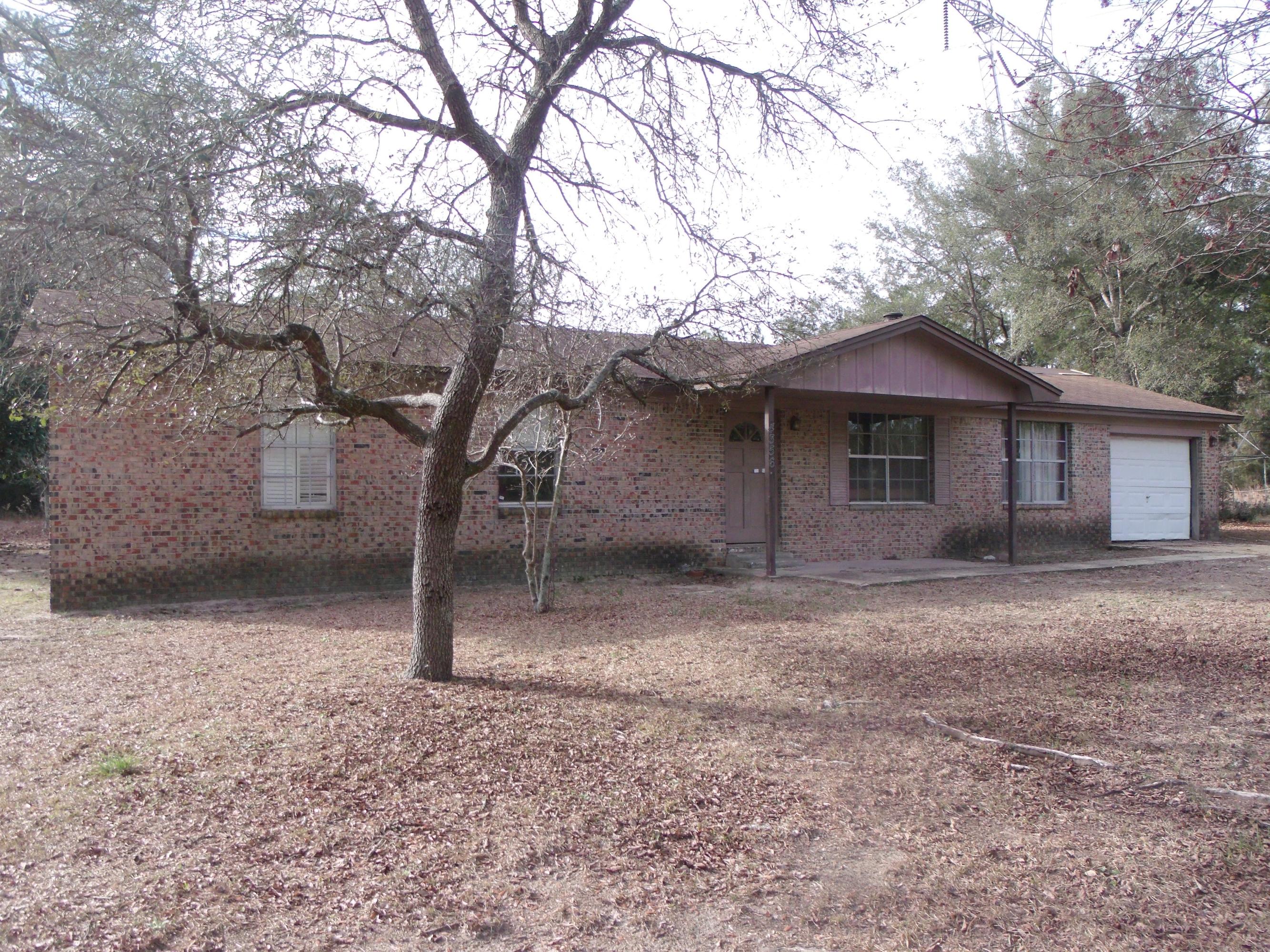 If your looking for privacy, elbow room and want a home to fix up to your taste. This 3.4 acre secluded all brick home may be the one your looking for. Home has a one car attached garage, fireplace in the family room and a den large enough for entertaining. Home needs lots of TLC but could be a great starter home or retirement home.