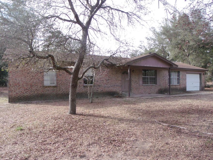 If your looking for privacy, elbow room and want a home to fix up to your taste. This 3.4 acre secluded all brick home may be the one your looking for. Home has a one car attached garage, fireplace in the family room and a den large enough for entertaining. Home needs lots of TLC but could be a great starter home or retirement home.