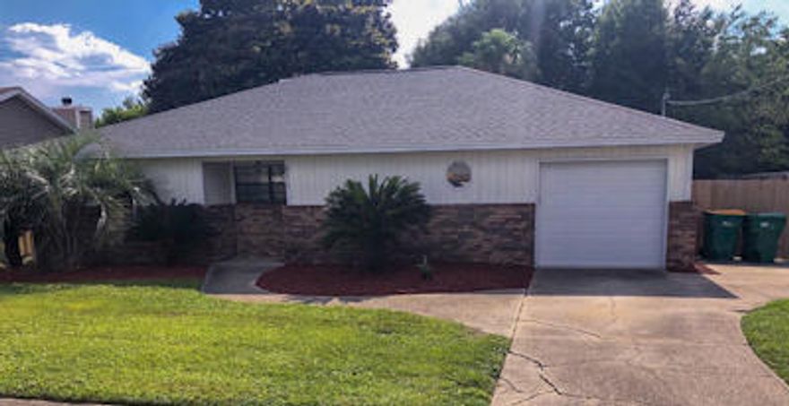 Lawn care and pool care included in the rent. This 4 bedroom 3 bathroom home is located in the heart of Destin. The in-ground pool is located in the privately fenced in back yard. There is a covered patio, and freshly landscaped back yard is a great place for entertaining. Upon entering the home, you will find an open floor plan with the living room and kitchen complete with beautiful hardwood flooring, a fireplace, and cathedral ceilings. The kitchen boasts a breakfast bar, granite countertops, with tons of counter space, recessed lighting, tile backsplash, and stainless steel appliances. The large master bedroom has a reading nook. The master bathroom has double sinks. There is a one car garage. The driveway offers plenty of space for parking. This home is pet friendly with restrictions.