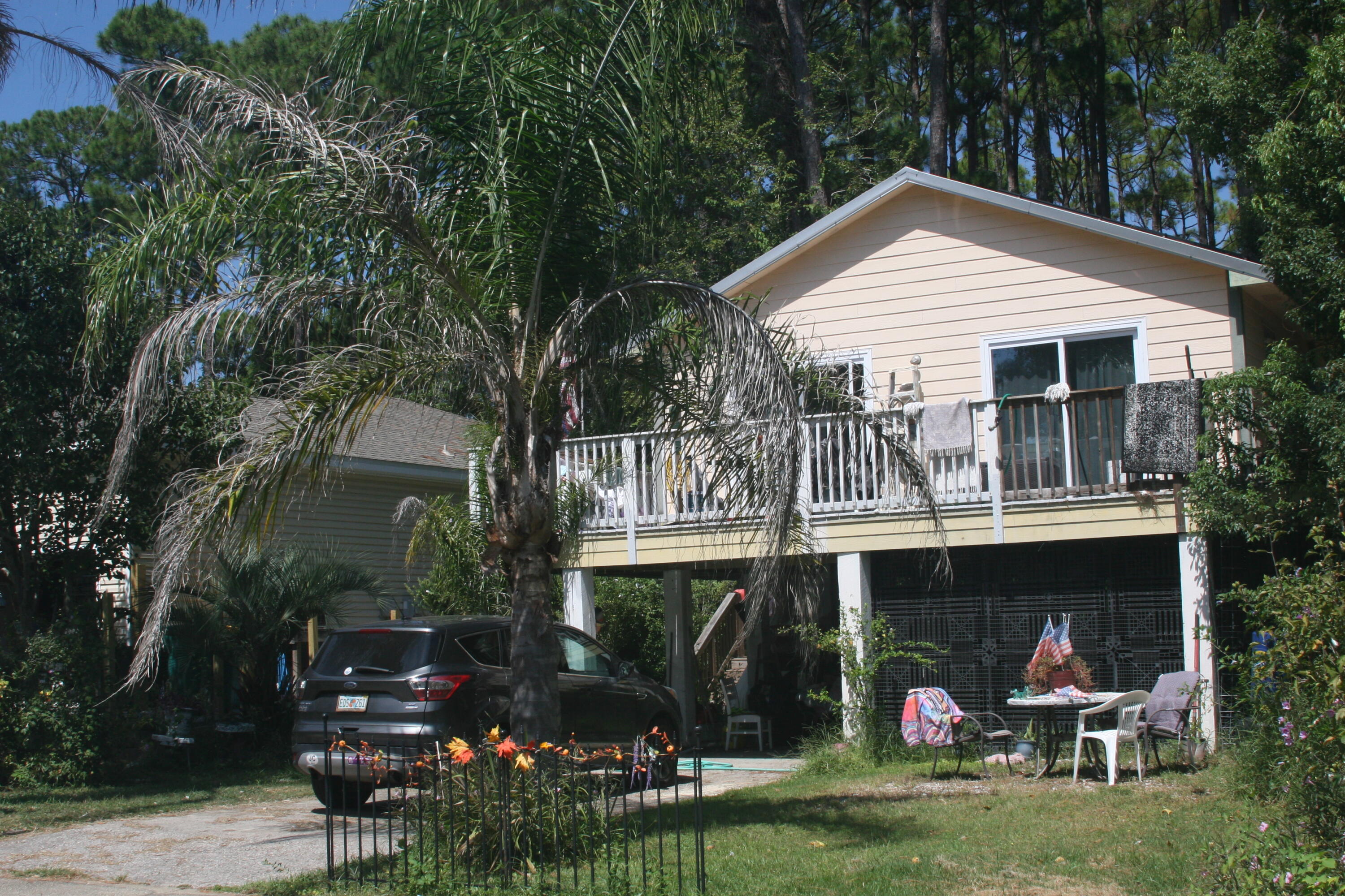 If you are looking for a great location in the heart of Destin, just minutes from the beaches and the famous Joe's Bayou, bring your boat and be ready to launch! HOME ON TWO large lots! This home is 3 bedrooms and 2 baths. One bathroom is an outdoor bath with shower and restroom perfect for days coming in off the beach! There is a NEW roof and NEW AC that is two years old. Large balcony goes around the exterior front of the home. Home is being sold AS IS. Needs some work but would make a great rental, first time starter home, or investment property! Buyer to verify square footage.