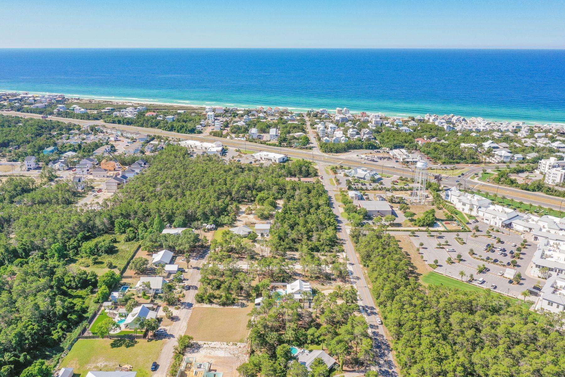 LAST lot available!!Located in the new development of La Bella Vita Estates, lot 5 is located less than a half mile to the Inlet Beach public beach access and just steps away from the shops and restaurants of 30 Avenue. This wooded lot is a quarter of an acre and can accommodate a pool, carriage house and up to a 5,000 square foot home. This quiet neighborhood in Inlet Beach offers the conveniences of Rosemary without the crowds. Lake Powell public boat launch is a short two mile distance from this lot. Whether it is lake or beach living you desire, both are just moments away from this unique lot.