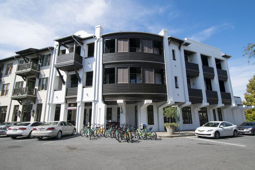 A serene sanctuary in the heart of a bustling beach town #6 Tabby Lofts provides the best of both worlds. Enjoy the peaceful, private balcony overlooking a park-like setting while the vibrant town center hums at your feet, or take the elevator to street level and enjoy the activity, shops & restaurants. This lovely, almost 2000sqft loft boasts three bedrooms, plus two bunks and three full baths on two levels. Elegant, dark-stained hardwood floors run throughout. Beautifully decorated, the living room and dining areas span a bank of windows and doors that may be opened to the large balcony to create an open flow between indoors and out.  The entire second floor is home to the master suite and living room.  Is that a peek of the beach from the master balcony?  Yes it is!  Closing mid Dec.