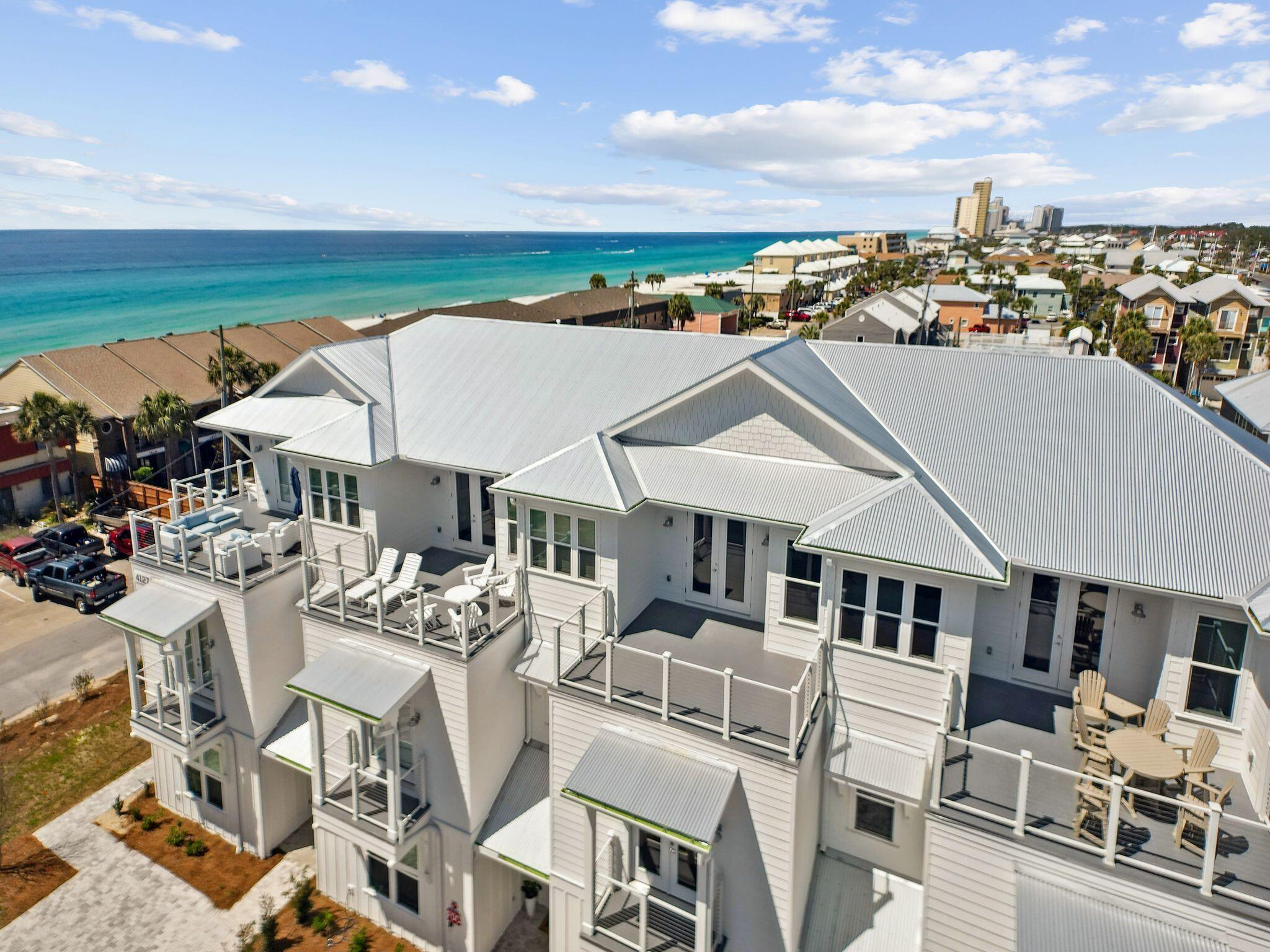 NEW CONSTRUCTION townhome with PRIVATE POOL! Located directly by beach access and VIEWS of Gulf from third level deck. Centrally located to restaurants and entertainment on the East end of Panama City Beach, this home would make an excellent vacation rental or second home. Professionally designed with a coastal feel, finishes include shiplap walls, white cabinetry throughout, sparkling white quartz counters, and honey oak luxury vinyl plank. Endless features include a private pool with pavered patio, large open main living area, game room with large deck, wet bar with wine fridge on third level, and spacious bunk room. Home also has an elevator for easy access to all levels. HOA fee is estimate and subject to change, homeowner will be responsible for maintenance of driveway, pool, etc.