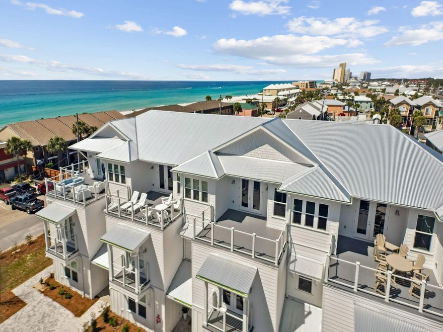 NEW CONSTRUCTION townhome with PRIVATE POOL! Located directly by beach access and VIEWS of Gulf from third level deck. Centrally located to restaurants and entertainment on the East end of Panama City Beach, this home would make an excellent vacation rental or second home. Professionally designed with a coastal feel, finishes include shiplap walls, white cabinetry throughout, sparkling white quartz counters, and honey oak luxury vinyl plank. Endless features include a private pool with pavered patio, large open main living area, game room with large deck, wet bar with wine fridge on third level, and spacious bunk room. Home also has an elevator for easy access to all levels. HOA fee is estimate and subject to change, homeowner will be responsible for maintenance of driveway, pool, etc.