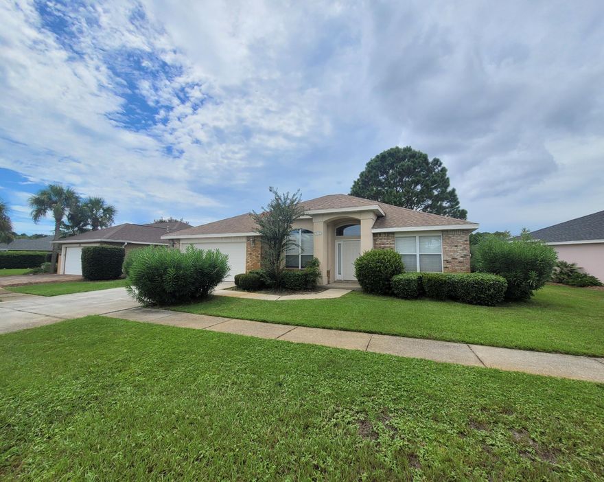 Welcome home! Beautiful 3 bedroom 2 bath home for sale in desirable Destin! This stunning property is nestled in the beautiful Indian Lake subdivision. Two car garage. Inviting foyer, which opens up to a large den with built-ins and a formal dining room. Huge kitchen with granite countertops and ample cabinet space. Breakfast bar. Spacious living room. Tall ceilings. Large back porch with access from the living room, spare bathroom, and master bedroom! Split bedroom layout for added privacy. The oversized master bedroom features trey ceilings and recessed lighting. Large master bath with double vanity, jetted tub, and walk in shower. Large walk in closet. This one is priced to sell! Schedule a viewing today!