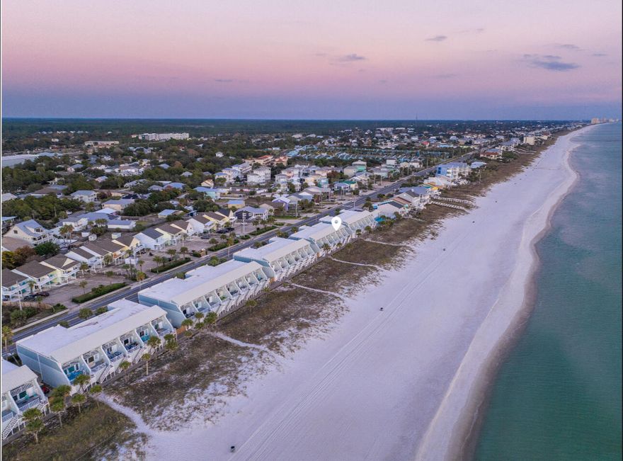 Beachfront 2 bedroom, 2 bathroom townhome with a bunk room and private garage, perfectly suited for a vacation home or short-term rental. The spacious layout comfortably accommodates up to 10 guests, with potential to sleep 12 using a pull-out sofa, making it highly appealing for larger groups.Enjoy bright, open living spaces just steps from the sand, with easy access to dining, shopping, and entertainment along Front Beach Road. With strong rental demand and a layout designed for maximum occupancy, this property offers an excellent opportunity for both personal use and income potential.