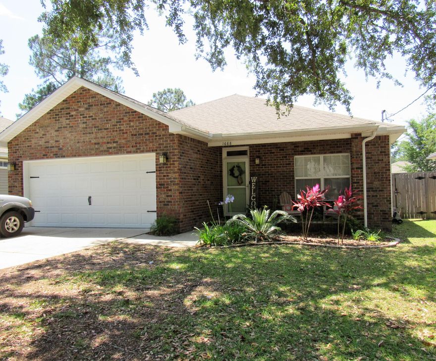 Greeted by a welcoming entrance this home is the perfect place to entertain friends & family as well to retreat to after a day out! Bright light & airy entrance foyer leads to open concept living, dining, kitchen. Living room hosts vaulted ceiling, kitchen has stainless steel appliances, granite, & breakfast bar. 2 bedrooms & hall bath off the entrance way and master bedroom/bath with dual vanitiies, updated mirrors, & walk-in closet to the back of the house. Upgraded LVP flooring in all main areas & front bedroom/office. Coastal colors throughout home. Enjoy the screened in back porch or the Fire pit/entertaining area in fully fenced back yard. 2 car garage and long driveway offer plenty of parking.