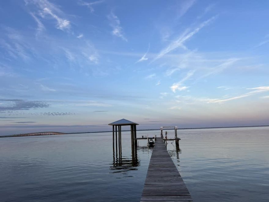 FURNISHED So close to all the best local amenities such as the beach, fantastic restaurants, HS, Courthouse annex and more, this gorgeous property sits directly on the water and reveals magnificent views and direct access to Choctawhatchee Bay. The home was recently renovated and offers an open floorplan concept with unique touches such as butcher block countertops, pecky cypress, modern tile, cork floor and carpets. The fireplace and a deep soak-in tub ensure the utmost comfort and intimacy in the in-suite. A large pantry, pool table, covered boat lift and jet ski lift, will provide the absolute best setting for entertaining. Additionally a vast sunroom and office can offer extra sleeping quarters to the existing three bedrooms. This home comes completely furnished. text 850 585-8400