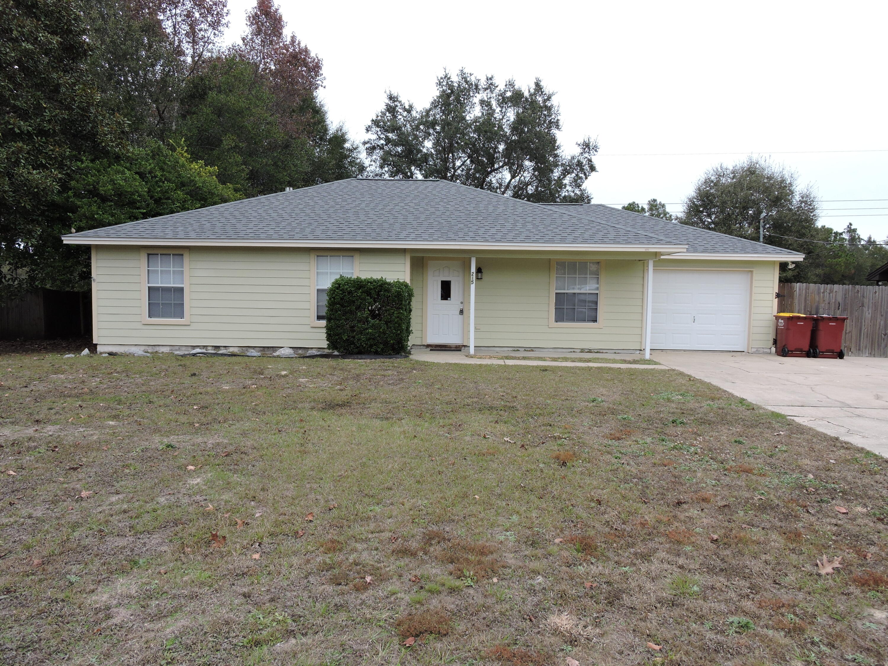 Available Now! Well miantained 3 bedroom/2 bath/1 car garage home located South of I-10 off of PJ Adams with easy commute to Eglin AFB, 7th Group.  The home features cathedral ceilings in family room accented by a wood burning fireplace.  The galley style kitchen features ample countertop and cabinet space with a large deck of the dining area perfect for entertaining.  The backyard in fenced.  The bedrooms are nice sized with ample closet space.  Schedule your showing today!