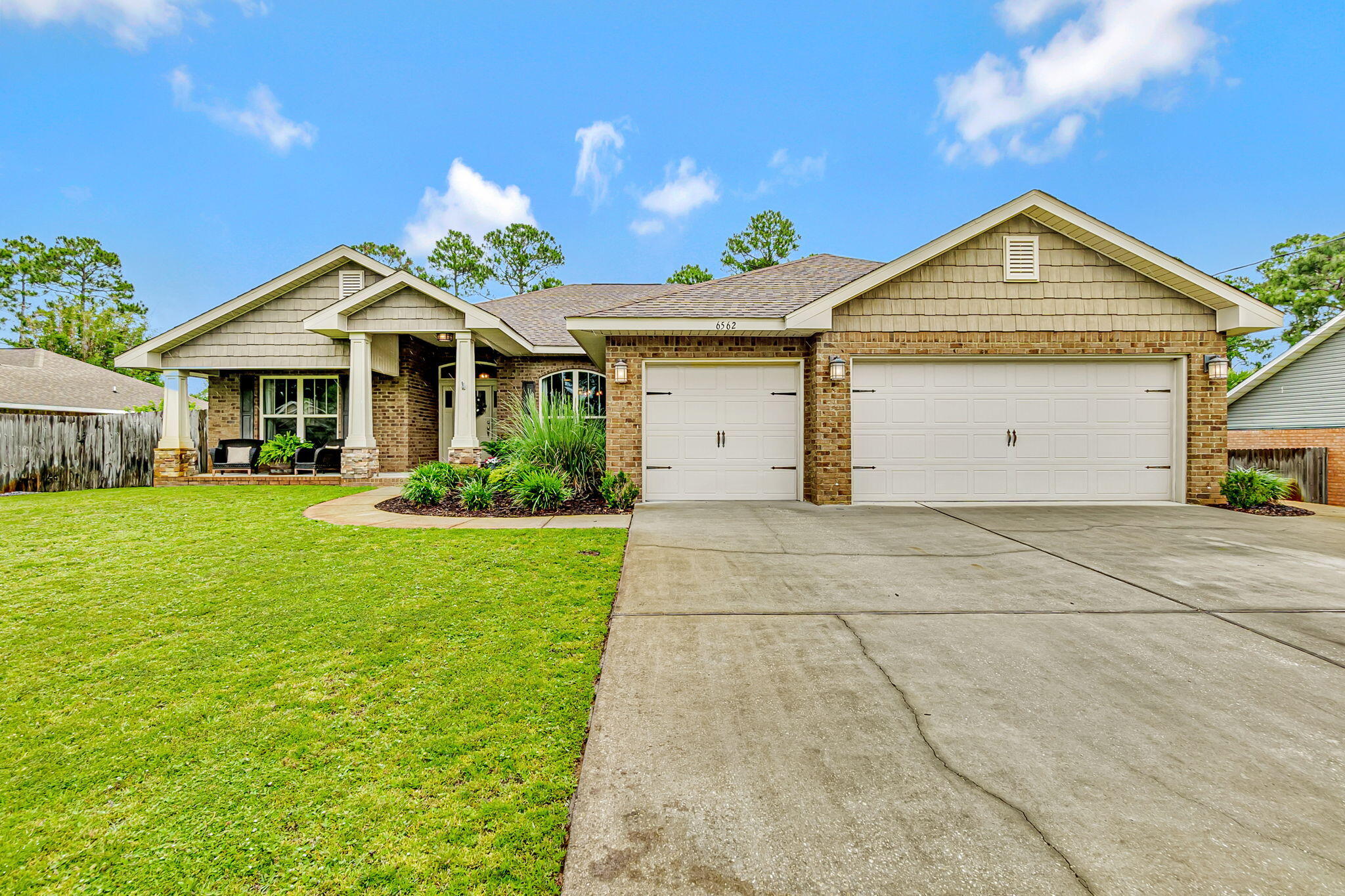 Step into comfort and functionality with this beautifully maintained 4-bedroom + bonus room, 3-bath brick home located in the sought-after Holley by the Sea subdivision! Spanning over 2,500 sq ft and nestled on a spacious half-acre lot, this home offers room to relax, entertain, and grow. Built in 2017, the property features a split floor plan with tile and LVP flooring throughout, freshly painted interior for a modern, move-in ready feel. Updated kitchen appliances (2023) all included! 3-car garage plus a dedicated RV/boat storage pad with electrical hookups. Whole-house reverse osmosis water filtration system, fenced backyard with a covered back porch - perfect for outdoor living. Additionally, the seller is offering $6,500 towards buyer closing costs and rate buy down.