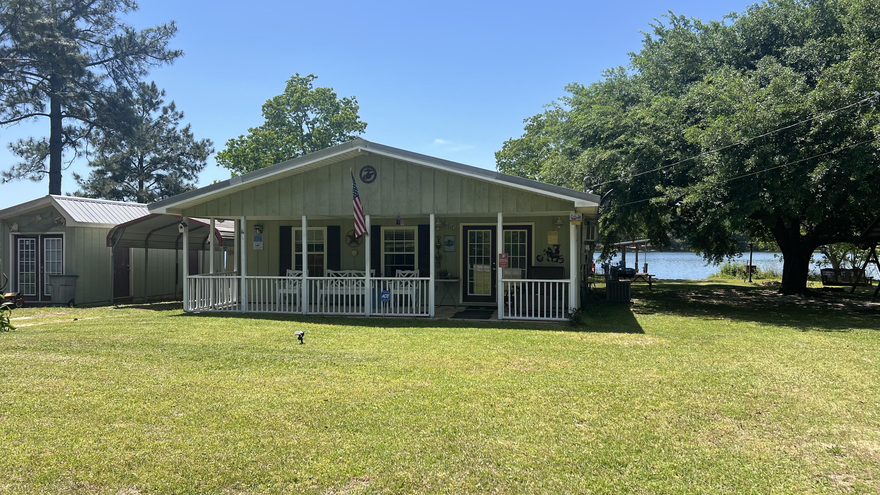 Seller offering $5,000 Towards Buyers Closing costs ! Welcome to your family's lakeside retreat! Nestled along the serene shores of King Lake, this charming cottage home offers breathtaking views and endless opportunities for relaxation and recreation.Step inside to discover a cozy haven adorned with paneling and featuring sturdy metal roofing, ensuring durability and rustic charm. The heart of the home boasts a spacious Florida room, perfect for enjoying the tranquil surroundings in any weather. Outside, a 66-foot-long dock stretches gracefully along the waterfront, providing a picturesque setting for leisurely afternoons spent basking in the beauty of King Lake.Come take a look today !!