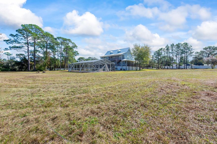 Rare 1.16 acre lot in Navarre in the beautiful neighbor of Whispering Pines; Lovely oak tress line this private and exclusive subdivision! Subdivision in the East Navarre area close to Hurlburt! This lot is part of multiple parcels being sold; listed with MLS 937616; also have lot on other side of home with .79 acres; Come view today!