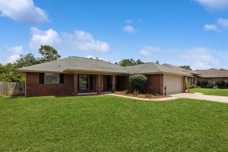 This spacious, all-brick home features an open-concept, split floor plan for the 3BRs, 2 baths & flex room. Dramatic, bamboo hardwood flooring throughout, FRESH interior paint! Kitchen highlights include granite countertops, breakfast bar & ample cabinet storage! Newly painted deck, FRESH landscaping & fully-fenced backyard! Property goes beyond fence & includes the creek! Underground irrigation system on private well! Only minutes from shopping, dining, Navarre Beach, Pensacola Beach--don't miss the Blue Angels show! Short commute to Hurlburt and Pensacola NAS! Be east or west quickly via East Bay Blvd!