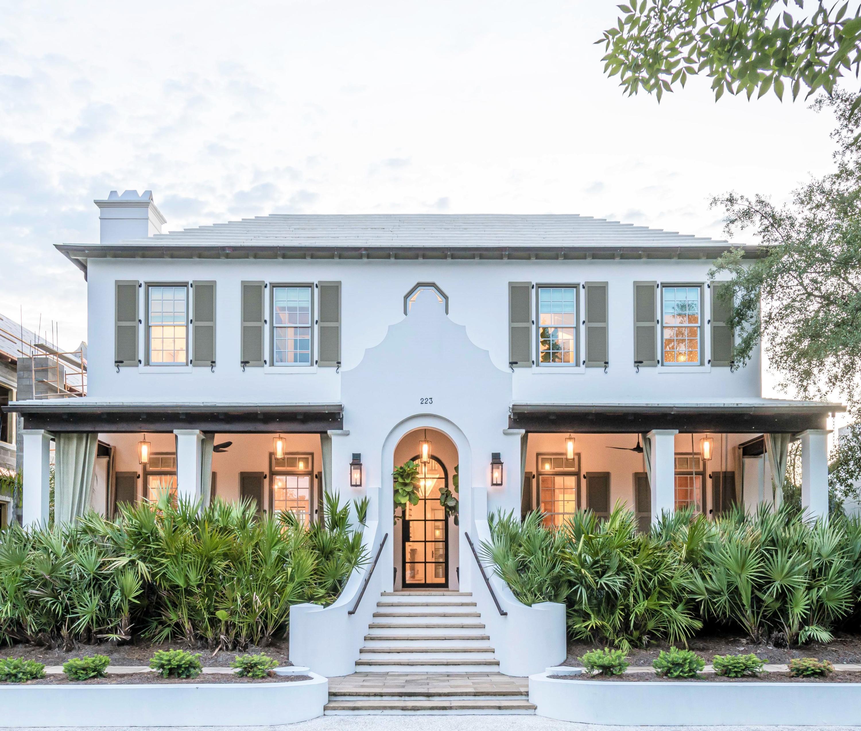 This Stunning Alys Beach villa designed by Cooper Johnson Smith Architects exemplifies a quintessential coastal retreat prominently located across from Central Park, the nature preserve, and within steps to Caliza pool. This idyllic lifestyle home offers fortified construction, custom designed interiors, and unique tile finishes throughout. The home was designed with hand-crafted elements to create a refined coastal feel with white oak planked walls in the dining room and champagne peacock pavers throughout the first level, Australian Cypress flooring on the stairs and throughout the second level, oak beams in the master bedroom suite, venetian plaster throughout, a two-car climate-controlled garage, large heated pool, and unparalleled outdoor living area for entertaining. The