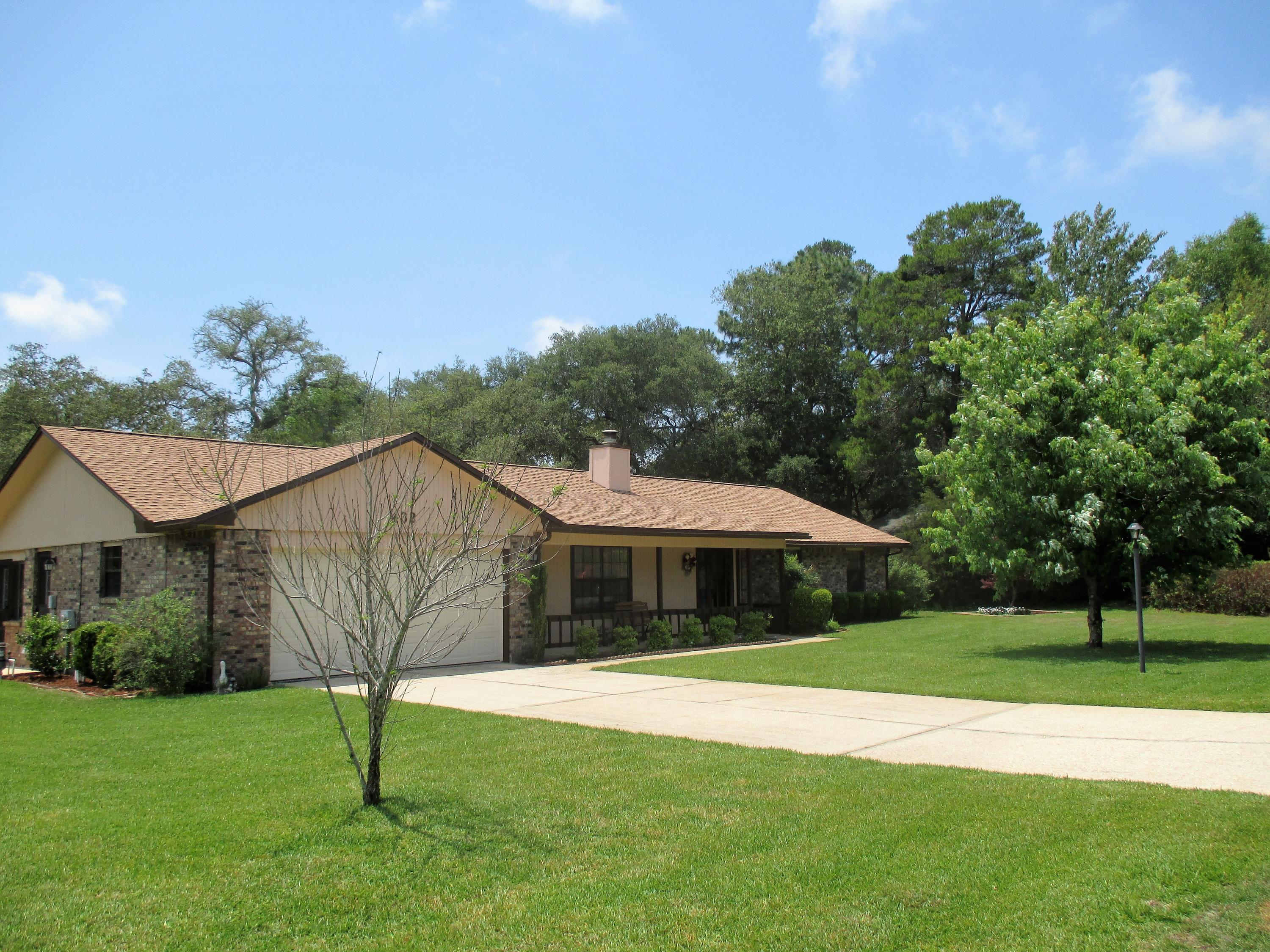 Picturesque Charmer in the heart of Bluewater Bay! Award worthy curb appeal will greet you at this enticing abode. Inviting front porch overlooks the well-manicured lawn on this big corner lot featuring beautiful landscaping & serene back yard oasis.The inside offers a large living room with fire place, formal dining room. Bonus, Florida & 4th bedroom are located on the east side. For your peace of mind: Polybutylene Plumbing in the entire house was replace in 2017, existing termite bond, roof was installed in 2015(50 year roof), chimney was rebuilt & inspected in 2015, lawn pump & well in 2011, HVAC replaced in 2008 still has warranty, garage door 2005. Location, Looks & great Value!!! Don't let this winning combination slip through your fingers.Make your showing arrangements today!