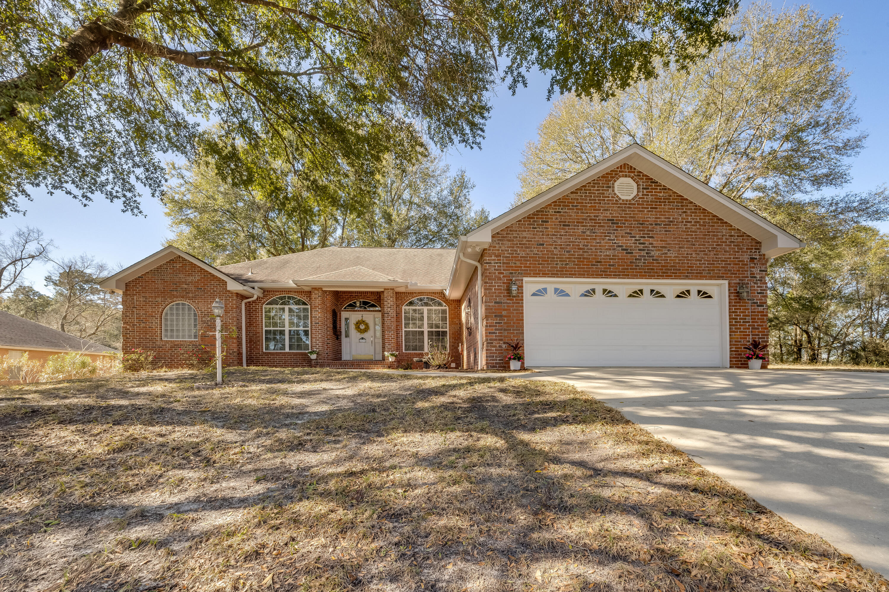 This custom-built home on the 11th fairway of the Blackwater Golf Course awaits you! 1st month of golf membership to Blackwater included! Sewer line install completed! Enter to vaulted ceilings in the living room featuring a cozy gas fireplace & 2 ceiling fans. Dedicated office space & formal dining room just off the foyer. The kitchen has 42' cabinets w/hop up breakfast bar. Head out back to the bright & airy Florida room w/serene views of the fairway. New carpet in bedrooms! The master bedroom is grand w/double tray ceiling & ensuite w/2 vanities, 2 walk-in-closets, cultured marble tub, separate shower & water closet. Split bedroom floorplan w/2 spacious bedrooms offers privacy. There's a large garage w/shelving, storage & side entry door to the extended driveway. See today!