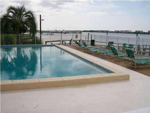 Don't miss out on this Super Nice Two Bedroom Condo, located in a Beautifully Maintained Waterfront Complex. Condo is a very bright and cheerful, two Bedroom, One Bath Unit with Balcony overlooking the Center Court Yard. Well maintained throughout, absolutely no work to be done, other than moving right in, and enjoy. Updated Kitchen and Appliances, Updated Bath with a very nice shower/tub surround, and fixtures. Updated A/C Unit, Large Living Room / Dining areas. Complex amenities include: Tennis Court, Club House with TV Lounge area, Pool Table, Full Kitchen for get togethers, Table Tennis, etc. Super large Pool and Sun Bathing Lounge area right on the IntereCoastal Waterway. All New decking.. Boat Slips are available to Rent on a 1st come, 1st Serve Basis.