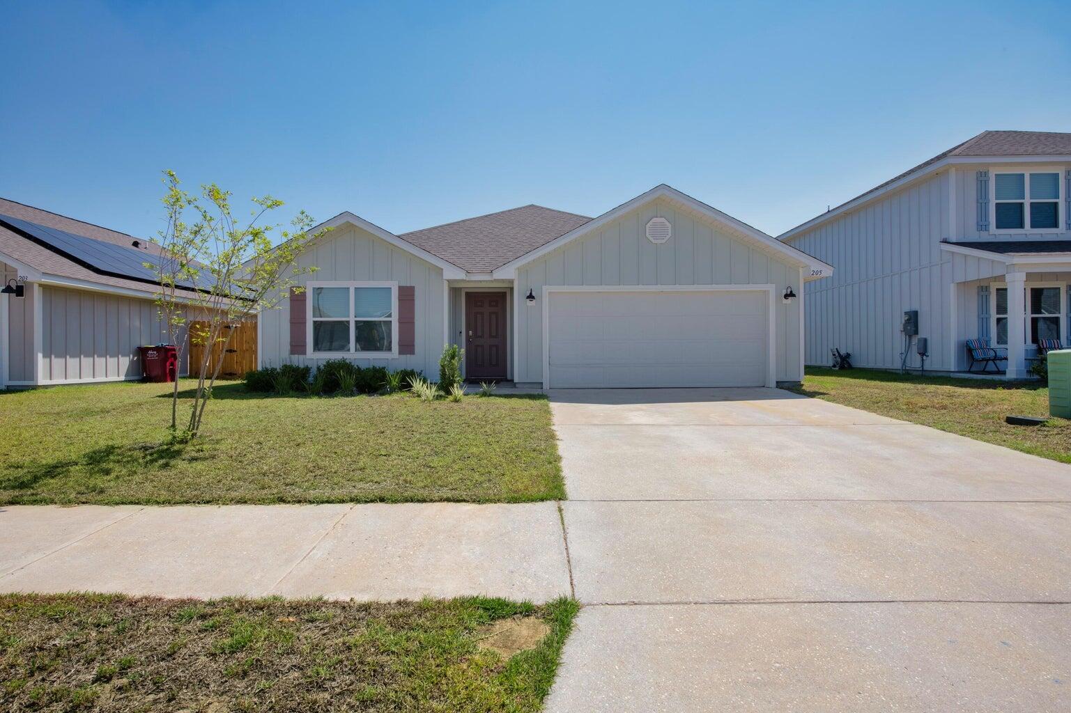 This 4 bedroom, 2 bathrooms offers a spacious open-concept design ideal for relaxed living a covered patio, and a 2-car garage. The kitchen stands out with its granite countertops, a large island bar, stainless steel appliances, a smooth-top range, built-in microwave, and a quiet dishwasher. The home also features LVP flooring with a wood-like appearance throughout, and Friese carpet in the bedrooms. The master bedroom is spacious, and the bathroom includes a walk-in closet, double vanity sinks, and a large shower. Shoal River Landing is a community that offers fantastic amenities, including a pool, pavilion, sidewalks, and underground utilities.  Pets may be considered pending owner approval and nonrefundable pet fee. No smoking allowed.