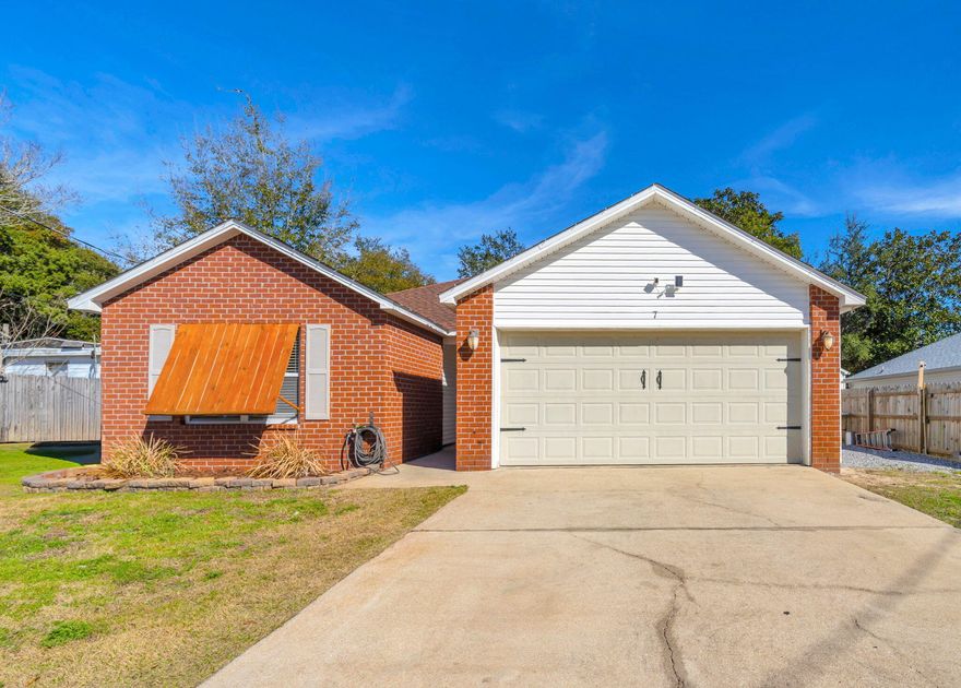 South of 98 | Under 4 Miles to Hurlburt | Boat/Trailer Parking | Move-In ReadyThis beautifully maintained home offers space, smart updates, and an ideal location for an easy commute to Hurlburt Field -- all less than 4 miles away and south of 98.The split-bedroom floor plan provides both functionality and privacy. The living room features a tray ceiling and crown molding, creating a warm and inviting space that flows seamlessly into the kitchen and dining area. The kitchen includes a breakfast bar, stainless appliances (replaced in 2025), and all appliances convey. The oversized primary suite is spacious enough for a king-sized bed with room to spare and includes a large walk-in closet. The primary bath features double vanities, a tub/shower combo, and separate walk-in shower. Both guest bedrooms accommodate queen-sized beds comfortably. The guest bath, located between the bedrooms, also includes double vanities and a shower/tub combination.

Recent updates and features include:
" Roof replaced in 2022
" Water heater replaced in 2022
" Fresh interior paint (2022)
" Stainless appliances (2025)
" Updated lighting in select rooms
" Faux wood blinds
" Tray ceiling & crown molding
" Laminate flooring in bedrooms
" Tile in kitchen and baths

Outdoor highlights:
" Privacy fenced backyard
" Sodded yard
" Covered patio
" Added deck with railing
" Double gate
" Dedicated boat/trailer parking with rock boat pad
" Sprinkler system with irrigation well
" Public sewer

Located in a limited traffic area with quick access to Navarre and Fort Walton Beach. Move-in ready and packed with value.