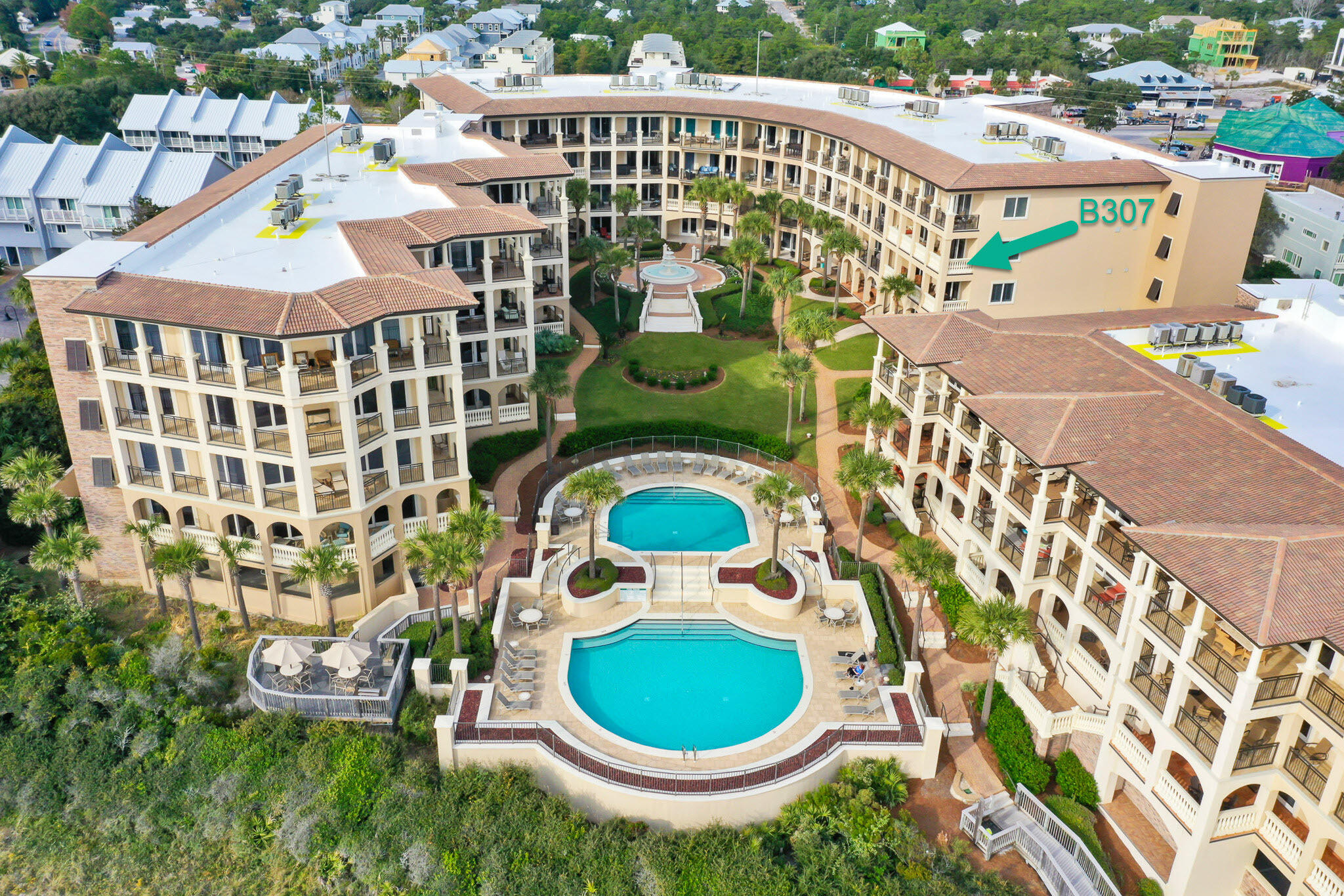 Coastal elegance awaits you in immaculate Bella Vita B307, a third-floor luxury residence in Blue Mountain Beach currently enjoyed as a primary residence. Relax on the expansive 319 sq. ft. veranda which extends the main living area and creates an outdoor living room with awe inspiring views of the Gulf, piazza and fountain leading to the Sunset Deck, two picturesque swimming pools, of which one is heated, and 365 feet of private beach. Rising above the highest point on the US Gulf Rim, living abounds from this luxurious, 3 bedroom, 3.5 bath updated home. Attention to detail and an eye for design is reflected in the owner's remodel. Step right into this chic, partially furnished condominium home with hard surface floors throughout. Upon entering, you will see, the Open Floor plan marries the kitchen, dining and living room while providing distinct comfortable spaces for entertaining coastal style. The radiant kitchen features bright, white painted Lynn Prestige custom cabinetry, ample quartz countertop space and beautiful marble backsplash. The dramatic Master Bedroom with gulf views lets on to the veranda and features two walk-in closets and a beautiful spa-like remodeled Master Bath. The guest ensuite bedrooms are separated from the master for the ultimate privacy and each guest bath has been updated. Full list of improvements available upon request.
As a Bella Vita resident, you will enjoy a gated and brick paved entrance, ample garage owners' parking, individual and shared storage, Fitness Center, Great Hall with conversational seating areas, kitchen, library and patio. A total of only 48 residences on 6 acres have 365 feet of beach to enjoy. Rentals are restricted to a minimum of 30 days. B307 is in the B Building so owners enjoy the added convenience of the Porte Cochere Entry at the Great Hall. You will immediately see the pride of ownership within the grounds and buildings of Bella Vita reflected by meticulous upkeep. Walk to a variety of restaurants, plus a bakery and lunch shop, a health food store, ice cream and donut shop, or rent or buy a bike steps away. Hop on the 30A bike path and explore the shopping, dining and entertainment of the nearby coastal towns. Retreat to your balcony at the end of the day in Bella Vita! No short term rentals. We invite you to make an appointment to see B307 and discover the beautiful life in Bella Vita!