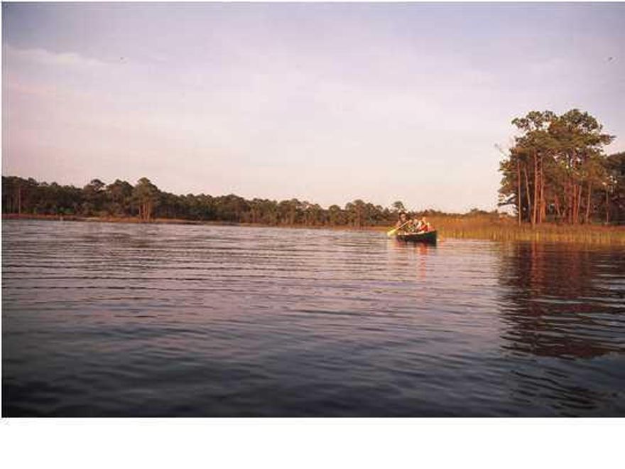 Pie shaped lot right on Western Lake in prestigious Phase III of Watercolor. With the opportunity for privacy, spectacular views and great location, you can build the home of your dreams.