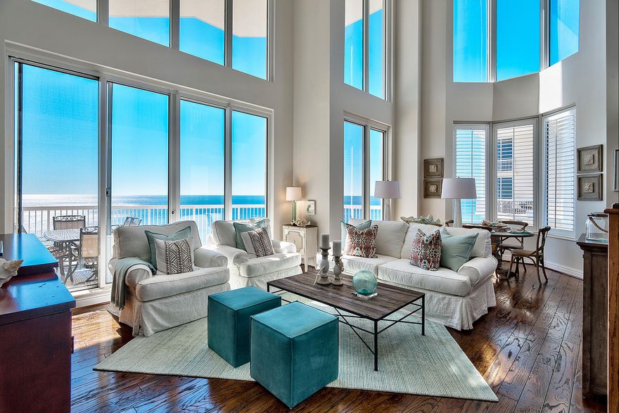 Enjoy a truly awe-inspiring view of the gulf through floor-to-ceiling glass lining the two-story great room of this west end penthouse at Silver Beach Towers East. With two gulf front master bedrooms, three spacious guest bedrooms, a second floor loft, and main floor family room, there is space for everyone, making this penthouse especially well-suited for comfortably hosting multiple parties or a large group. Your luxurious experience begins before setting foot inside. This penthouse includes a private, enclosed garage within the covered parking garage, capable of accommodating two vehicles. Professional beach chair service leaves no second thoughts about enjoying the beach on a whim and at y Both the great room and main floor master bedroom enjoy access to the two-story covered terrace, providing the perfect vantage point from which to enjoy sunsets over the gulf during the fall and winter months. The second floor master bedroom overlooks the terrace from its Juliet balcony, and each of the guest bedrooms feature access to covered terraces with scenic views of Choctawhatchee Bay to the north. Amenities offered by this premier waterfront property include two pools, two hot tubs, a spacious sun deck with tables, chairs, and lounge chairs, as well as grills, picnic tables, and a tennis court. Silver Beach Towers is approximately two and a half miles west of Destin Commons outdoor lifestyle center, and just over three miles east of Harborwalk Village, home to shopping, dining, seasonal entertainment, and chartered fishing excursions, located directly on the renowned Destin Harbor.