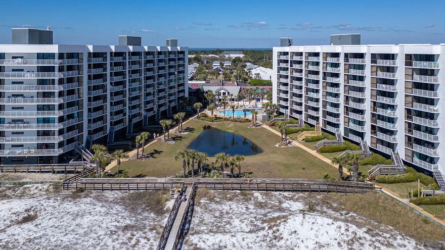 Welcome to your Beachside getaway!  This beautifully updated 2 bedroom 2 bath condo offers sweeping views of the Gulf and direct access to the sugar white sands.  Step into an open living space filled with natural light and coastal charm.  The fully equipped kitchen features new appliances, a breakfast bar and washer/dryer.  Relax in the master suite with your private balcony access and an upgraded en-suite bathroom with tiled shower.