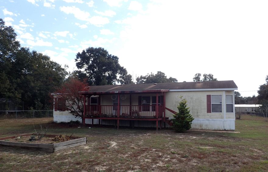 This 2005 4bedroom 2bath REO mobile home rests in a quaint country setting and exudes that country feel, while being fairly close to city amenities. This .84 acre parceled property is completely fenced and the 4 bedroom split bedroom mobile home has a large kitchen area, indoor laundry, oversized living room and dining area. Home has tons of potential and is a must see. Call today for your showing!