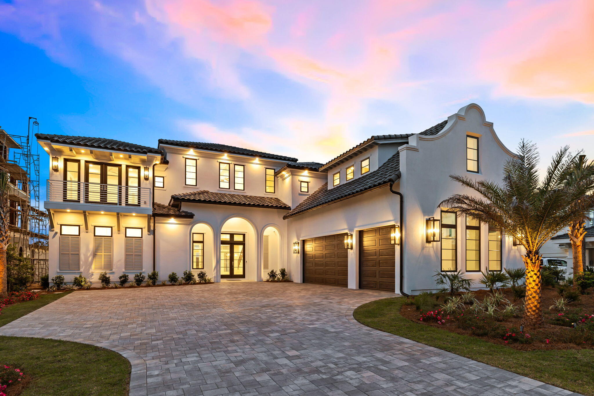 Pristine architectural design, paired with sweeping golf course views and breathtaking Gulf vistas, define this exquisitely positioned new construction in the exclusive, gated, non-rental neighborhood of BellaMar at Gulf Place. Perched 31 feet above sea level, this property offers a unique vantage point, blending luxurious living with serene natural surroundings. Masterfully built, this 7,476 sq ft Mediterranean retreat has been beautifully designed to capture it's striking architectural features including a soaring parapet wall as well as a highly functional design including an impressive oversized three car garage and private parking court as well as resort style amenities all of which are situated on the coveted Santa Rosa Beach Golf Course and providing direct deeded beach access.

Poised at a high elevation, gulf views abound from each of the three viewing levels of this home which abundantly provides ample indoor and outdoor living space with five full bedroom suites, a bunk room, office space, elevator and multiple levels of open living. 

The first level is optimally configured for entertaining featuring an expansive open living, kitchen and dining space primarily focused on the exceptional western vistas of the golf course as well as the resort style private pool & spa. 

The chef's kitchen is a premier configuration offering ample custom cabinetry, gas-powered Wolf range, stainless appliances with a massive center island including a built-in Sub-Zero refrigerator and adjacent fully equipped butler's pantry. 

The primary living areas effortlessly flow to the rear entertaining deck, which yields an oversized resort style pool and spa, covered lanai with outdoor kitchen space and half bathroom. Fenced privacy and low maintenance landscaping allow for an enjoyable golf course frontage that provides both views and ambience. 

The primary suite is also located on the first level and offers ample space for storage with a massive primary and secondary closet as well as the primary bathroom with dual vanities and makeup space, large walk-in shower and private water closet. 

The second level hosts four large bedroom suites with en-suite baths as well as a large exercise, bonus and game rooms which hosts a built-in linear fireplace and access to the top floor viewing deck. Other notable features on the second floor include a large bunk room with 4 built-in queen bunk-beds as well as a two built-in kitchenettes and a full second laundry room.

The third level viewing deck offers excellent accessibility while hosting the perfect location to soak in endless sunsets over the Gulf of Mexico as well as the pristine naturalistic surroundings of the golf course. 

BellaMar is the ideal primary residence or secondary home with exceptional positioning on the west side of 30A providing excellent proximity to the Santa Rosa Golf & Beach Club, Gulf Place with it's premier restaurants, shopping and entertainment as well as private, deeded beach access along pristine white sand beaches and emerald green waters.

Please reach out to us today for the cost-to-own figures for the property.