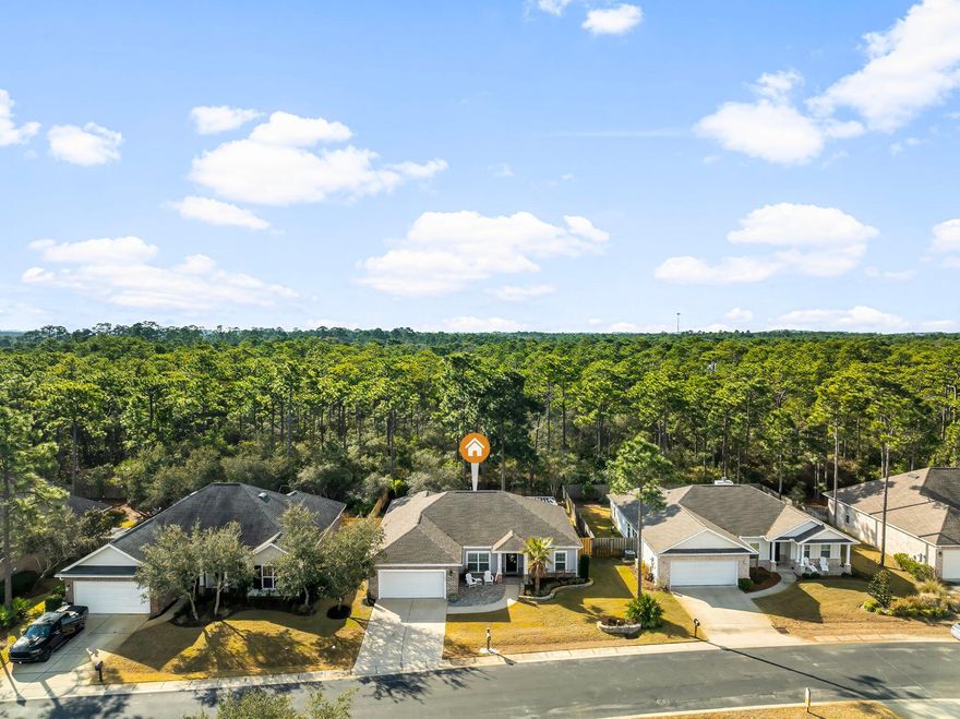 Practically new one-story home in Forest Park, backed up to the preserve! Lightly lived in, this residence features new landscaping, a split floor plan, LVP flooring, plantation shutters, and recessed lighting. The gourmet kitchen boasts granite countertops, a double oven, a Miele dishwasher, a separate under-counter ice maker, and a walk-in pantry. The master suite includes a luxury open-concept walk-in shower with dual shower heads. Outdoor living shines with a covered paver patio, outdoor kitchen, and fenced yard. Additional highlights: two-car garage with mini-split A/C, tankless water heater, and a CASPR air purification system. Located in a peaceful, no short-term rental community offering privacy, a tight-knit neighborhood feel, and close to schools, parks, shopping, and beaches.