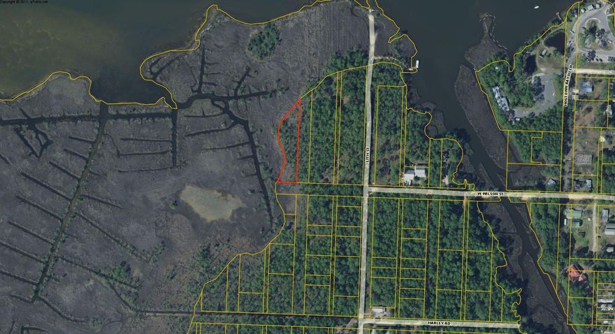 Vacant land with views of Hogtown Bayou and the Bay. Zoned CR (conservation residential)
